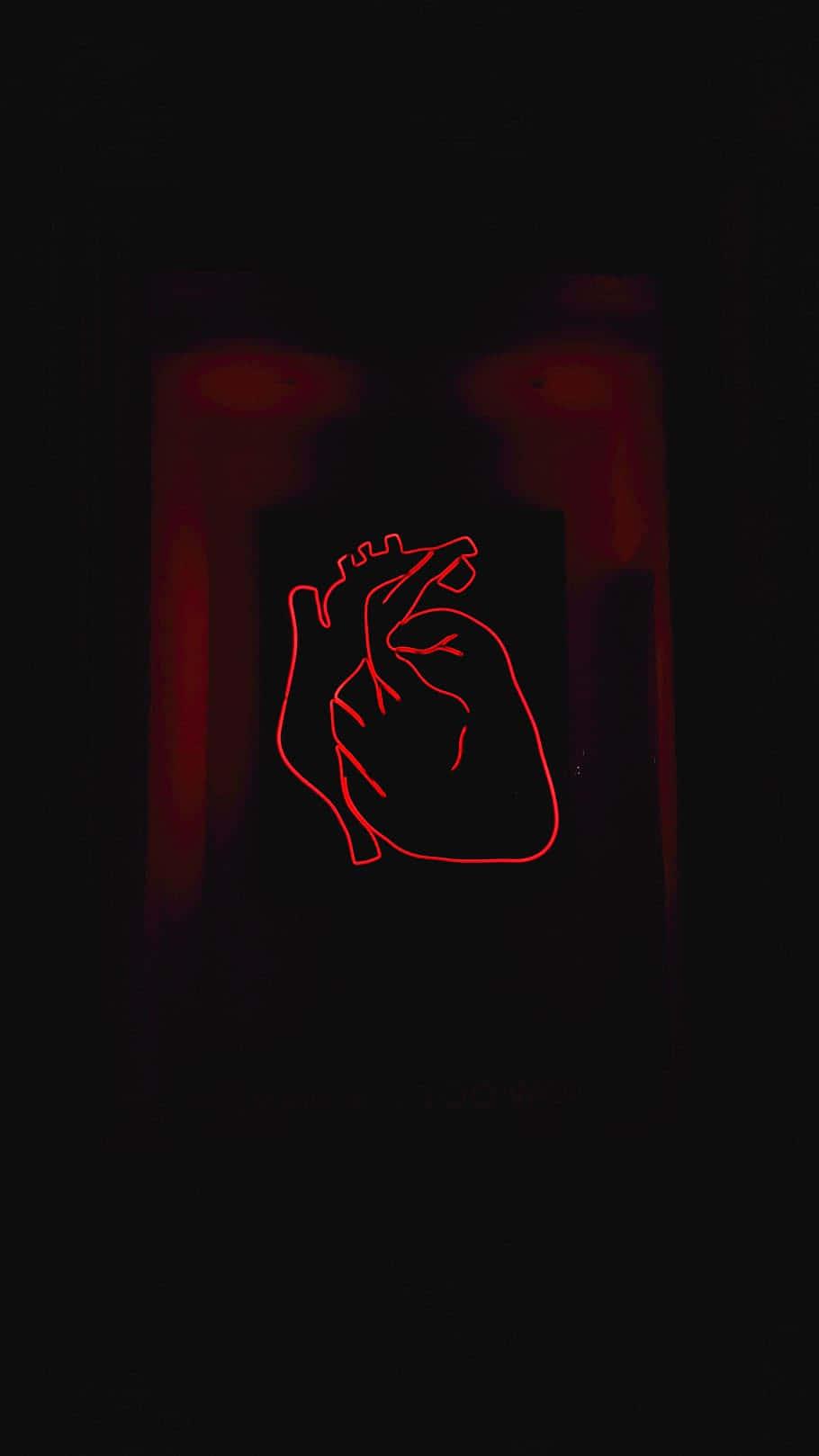 A broken heart symbol against a black background — 910x1618 wallpaper