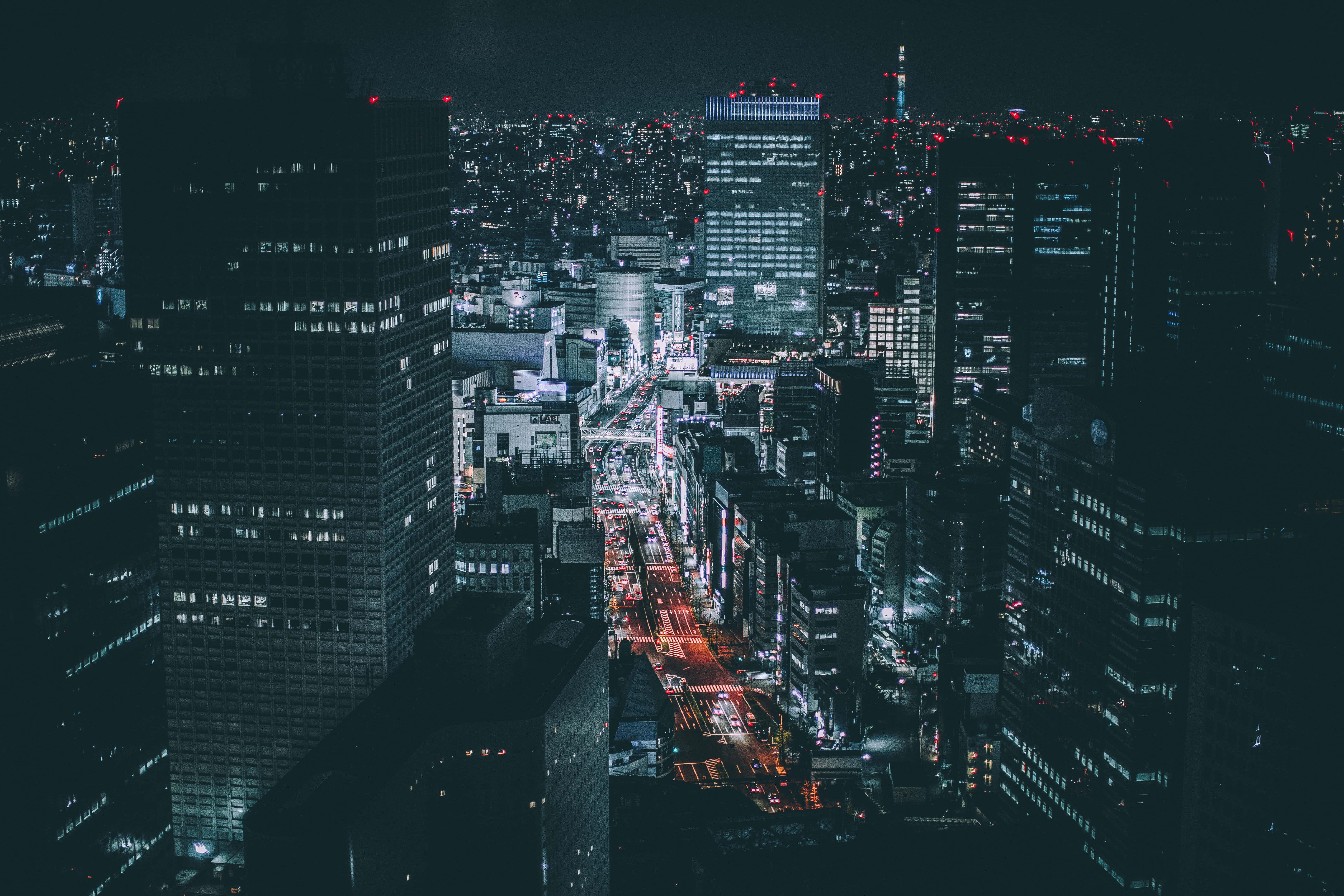 a city at night with lights and buildings — 6512x4341 wallpaper