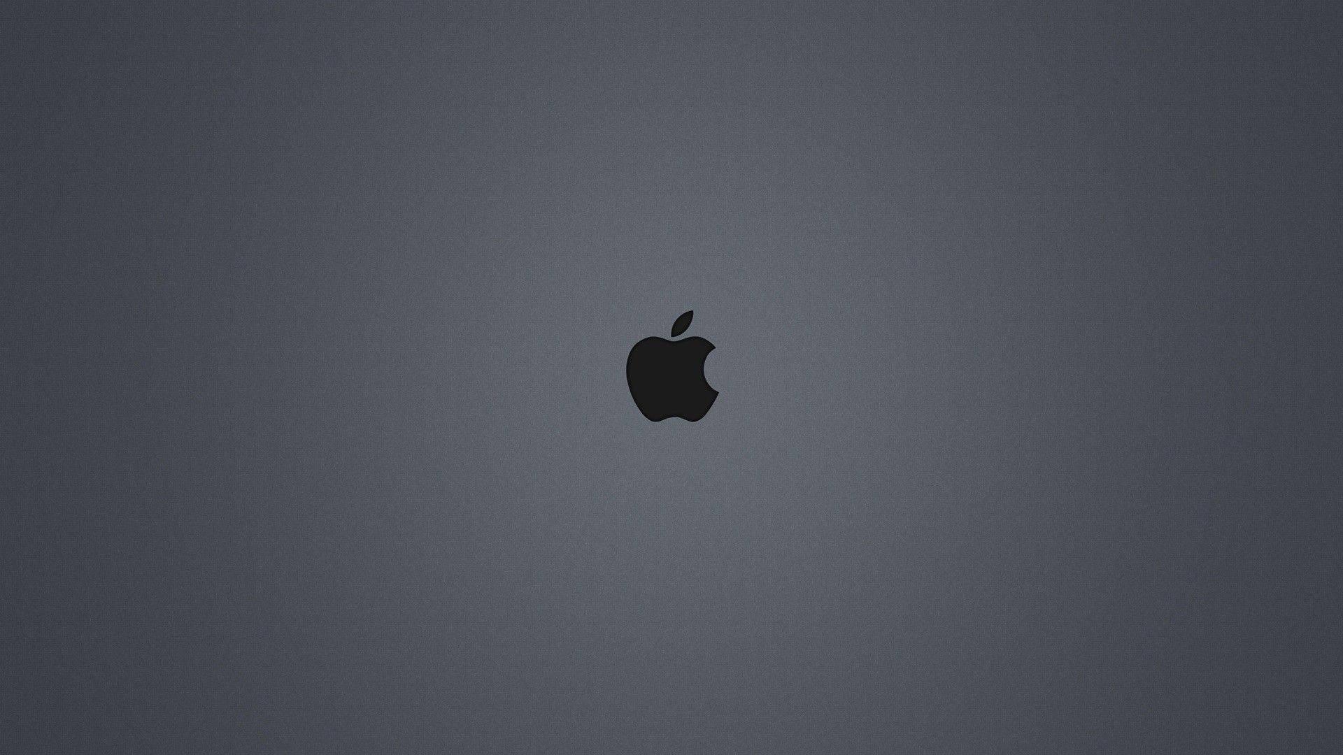 A dark-gray background illuminated by the iconic black Apple logo — 1920x1080 wallpaper