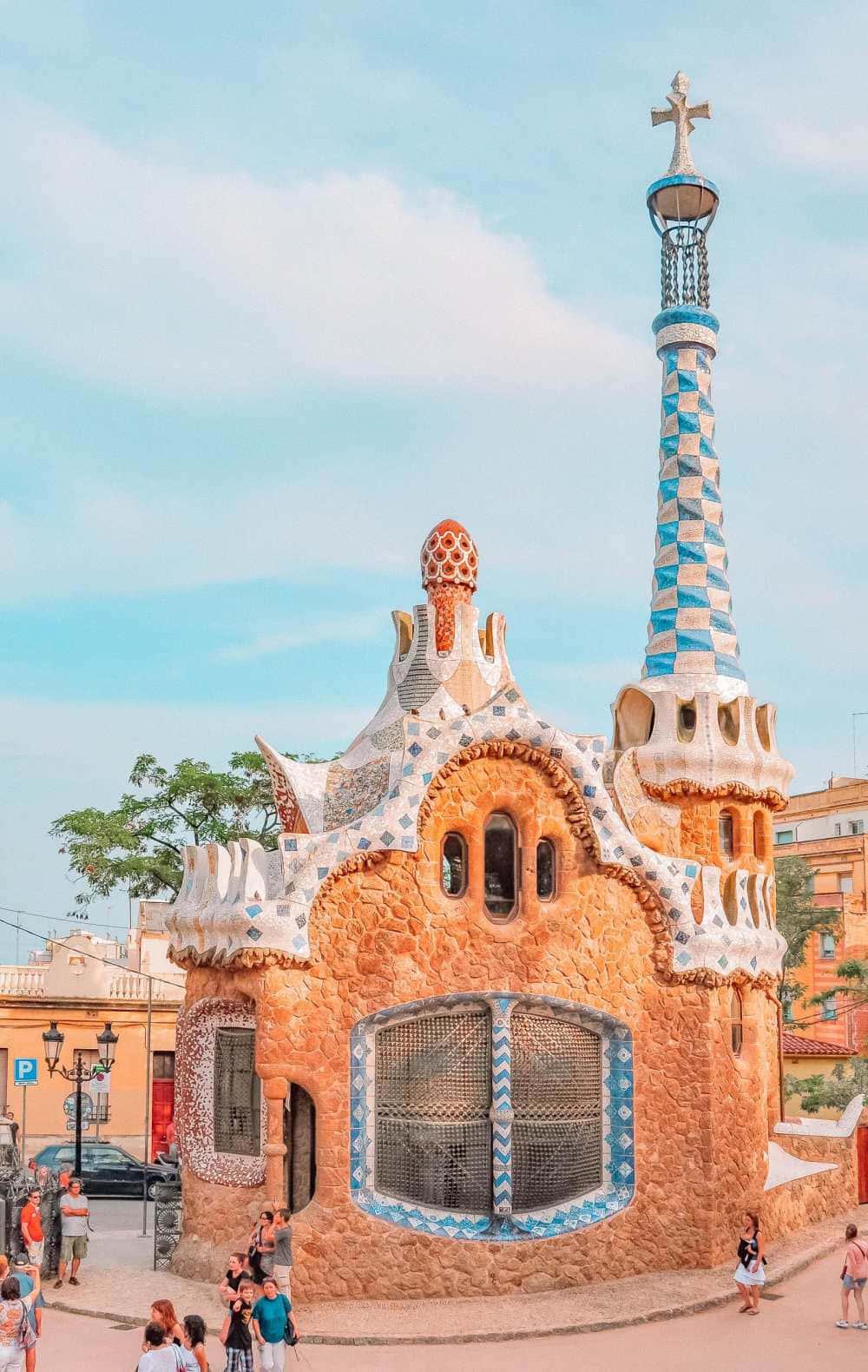a group of people walking around a building in barcelona — 1000x1580 wallpaper