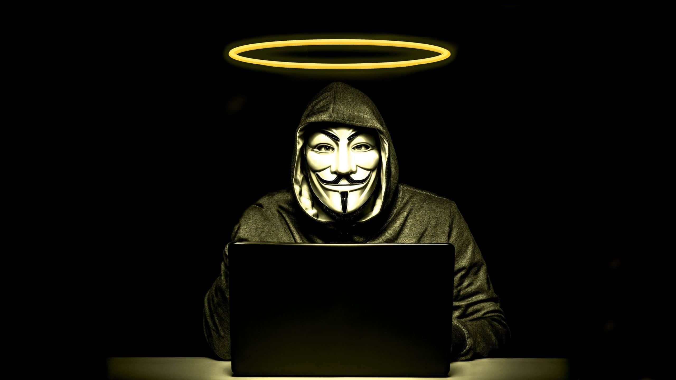 A Hacker Coding in the Digital World — 2560x1440 wallpaper