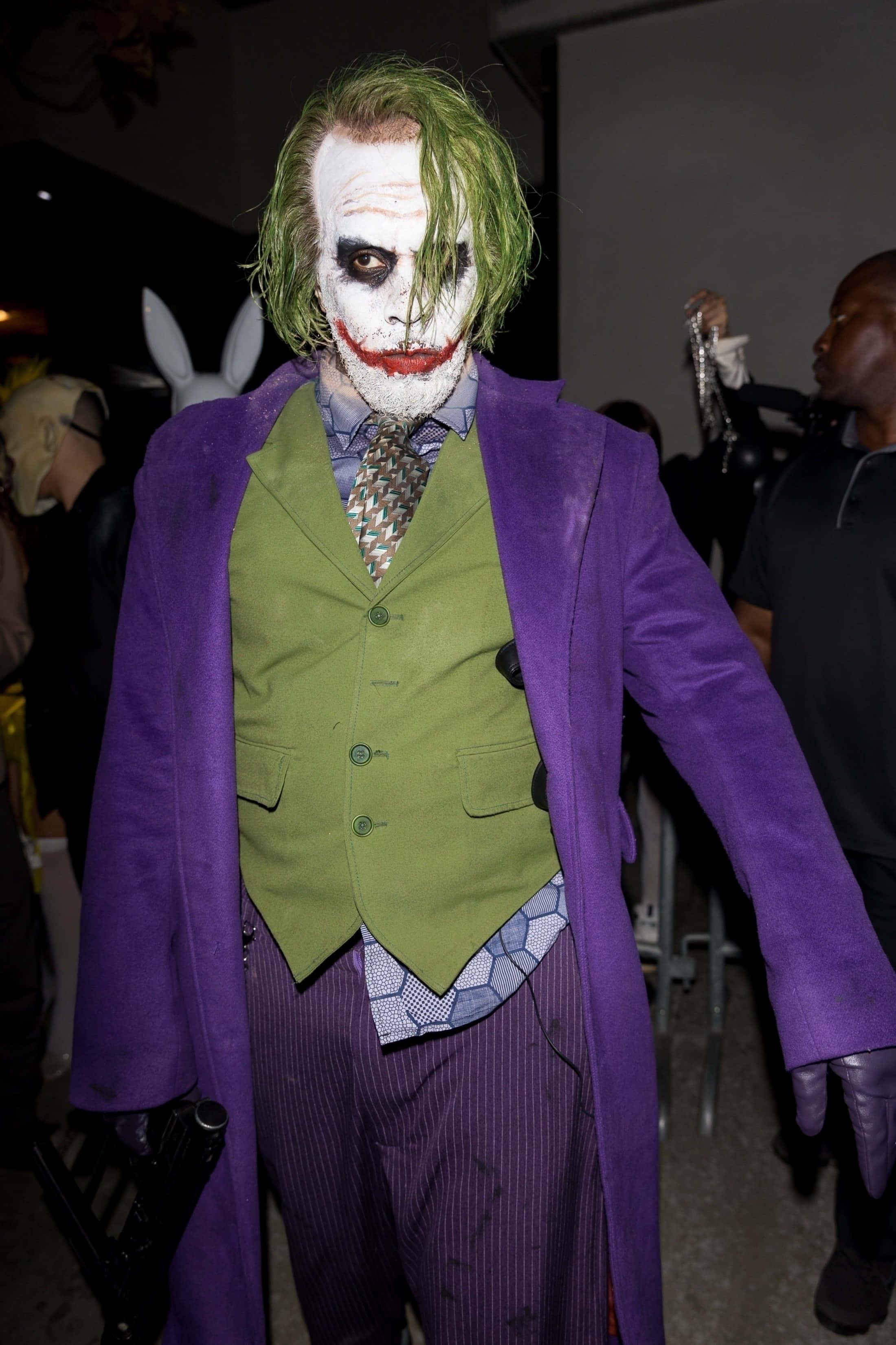 a man dressed as the joker — 2200x3300 wallpaper
