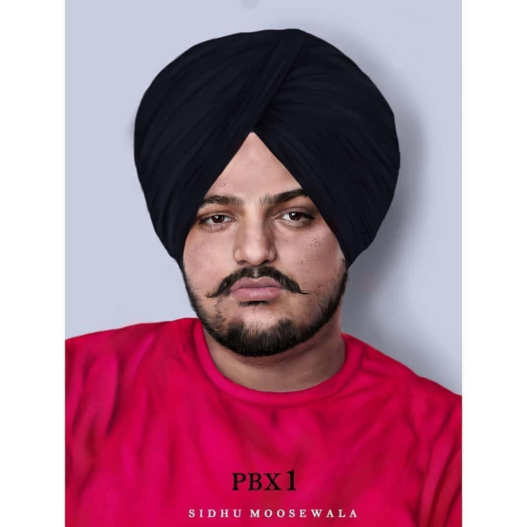 Ein mann im turban posiert fuer ein foto