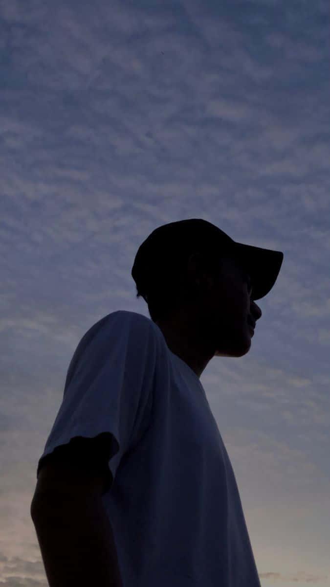 a man is silhouetted against the sky — 675x1200 wallpaper