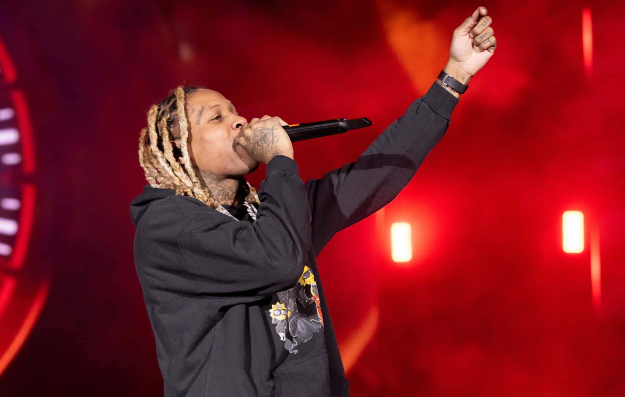 a man with dreadlocks is holding a microphone — 2000x1270 wallpaper