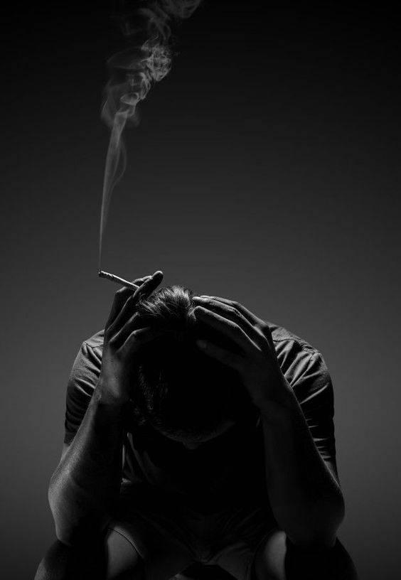 A Mischievous Man Leaning on Wall — 564x816 wallpaper