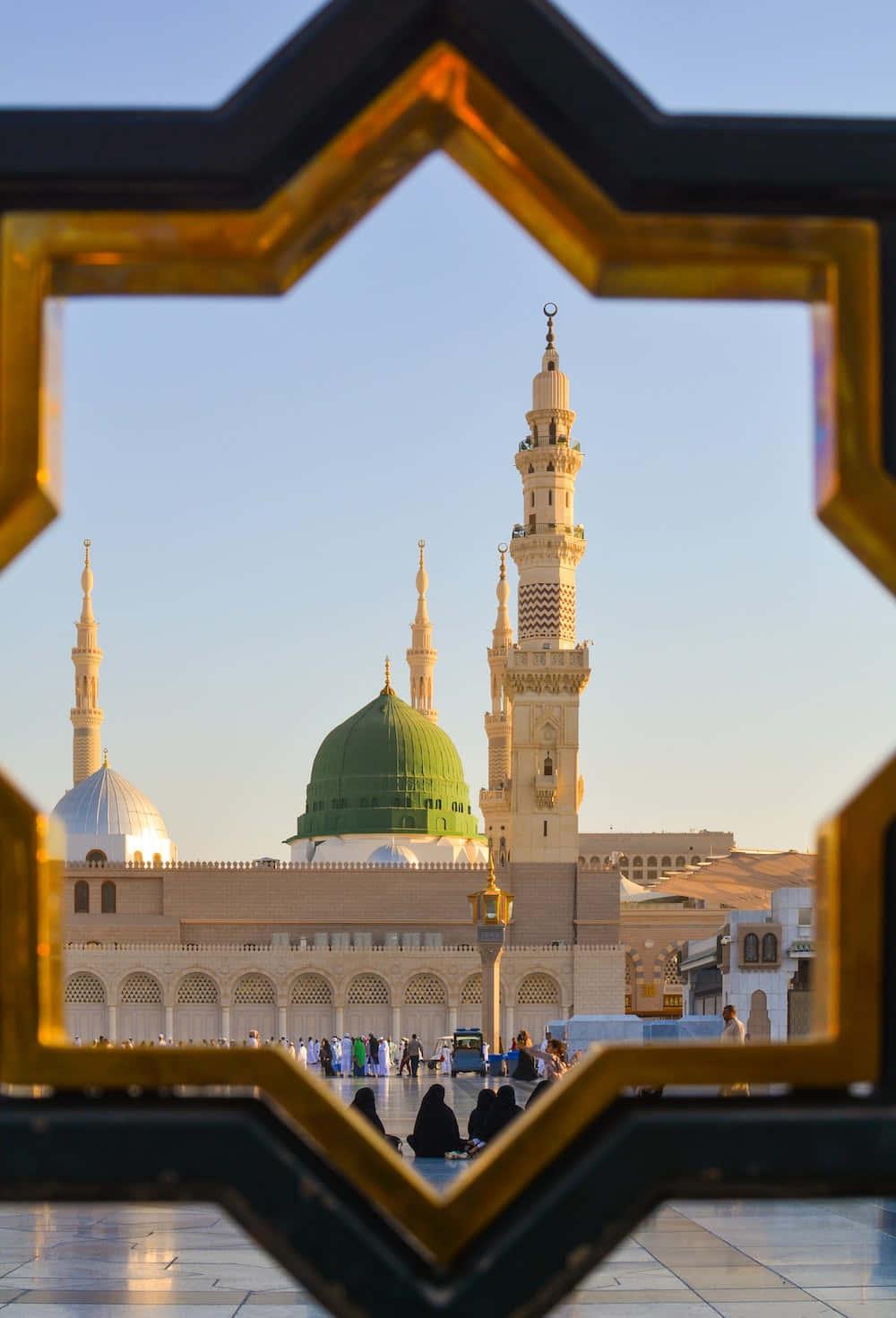 a mosque with a golden frame in the background — 1000x1471 wallpaper
