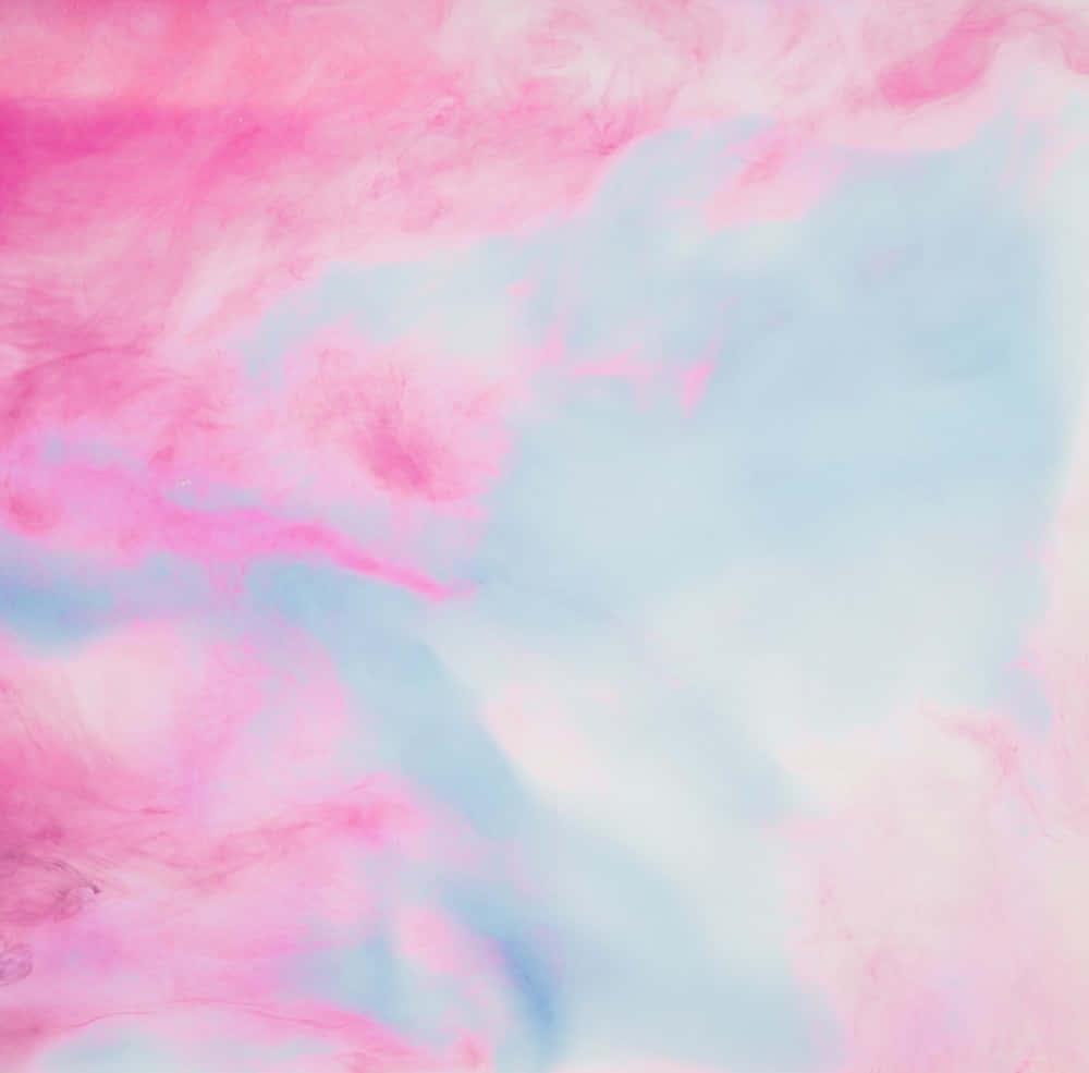 a pink and blue liquid paint on a white background — 1000x985 wallpaper