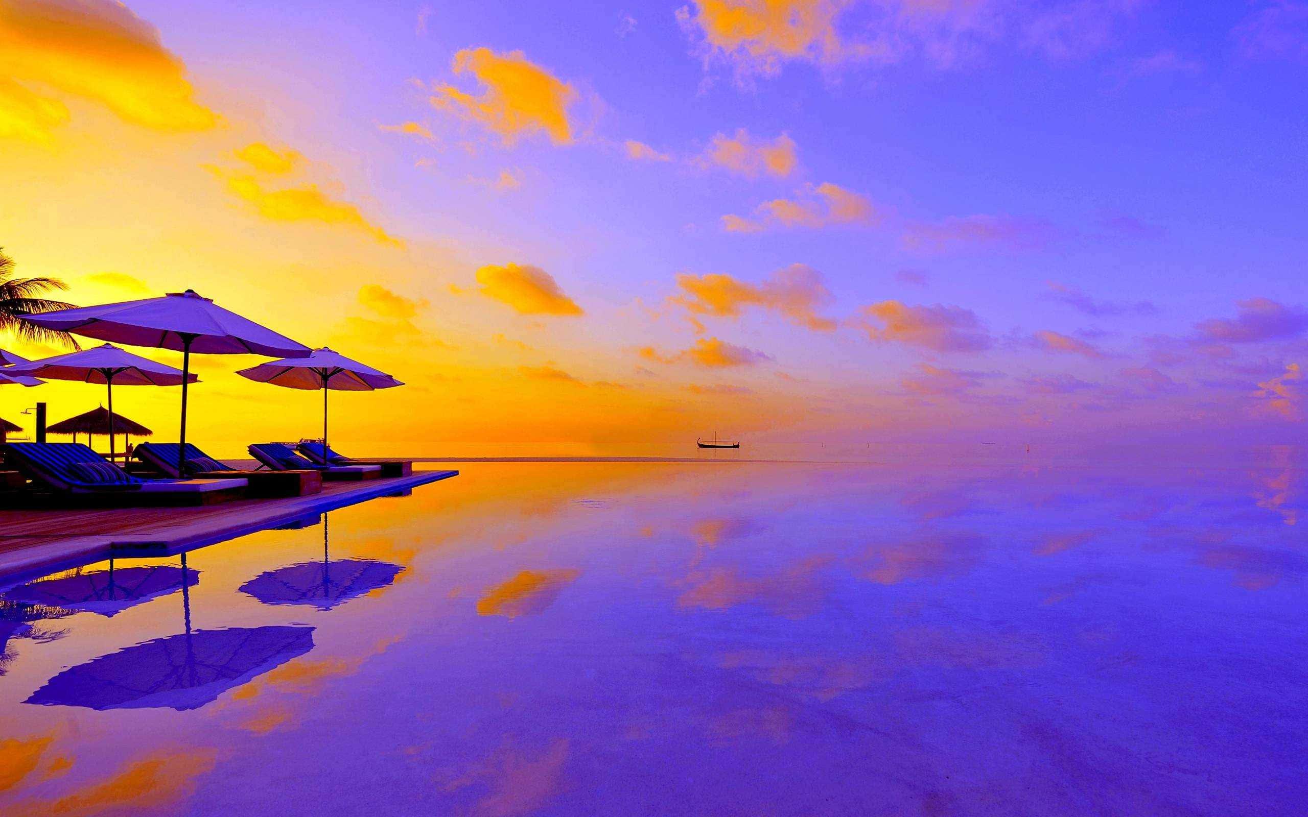 a pool with umbrellas — 2560x1600 wallpaper