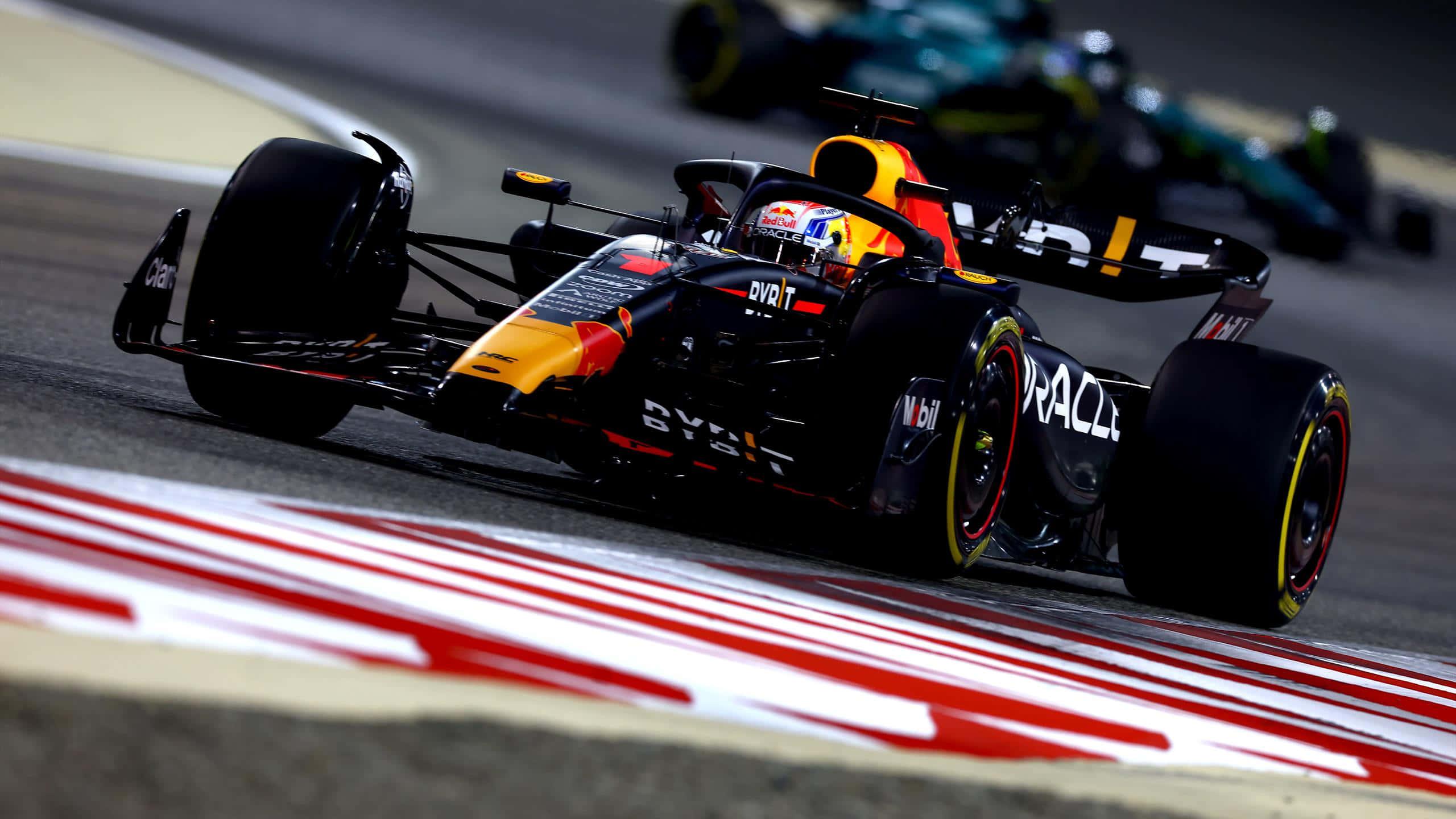 a red bull racing car driving on a track — 2560x1440 wallpaper