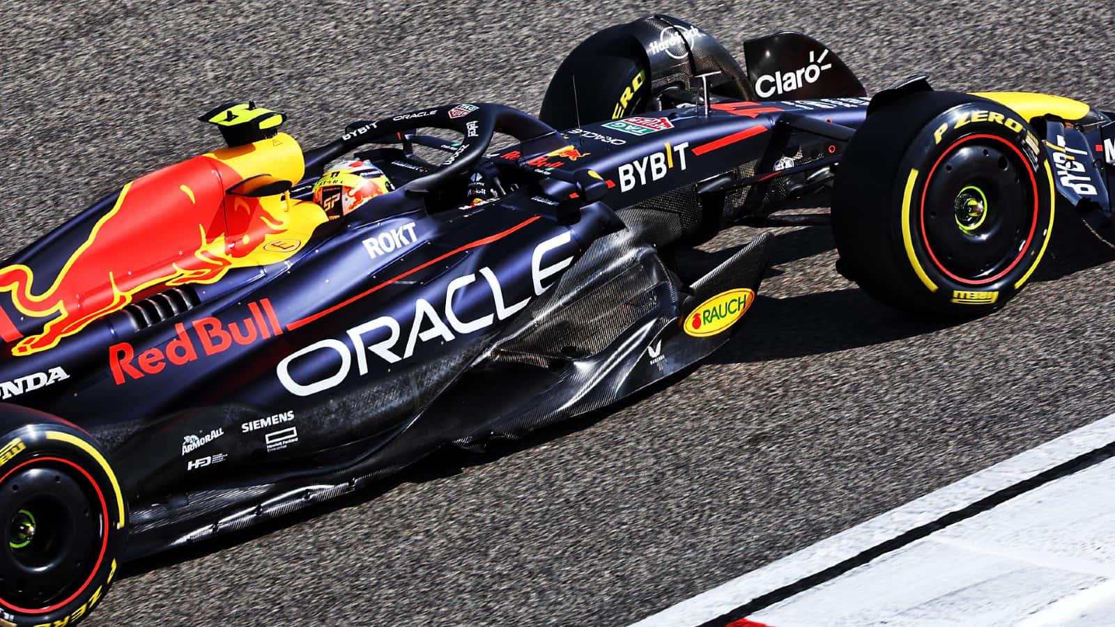 a red bull racing car is driving on a track — 1600x900 wallpaper