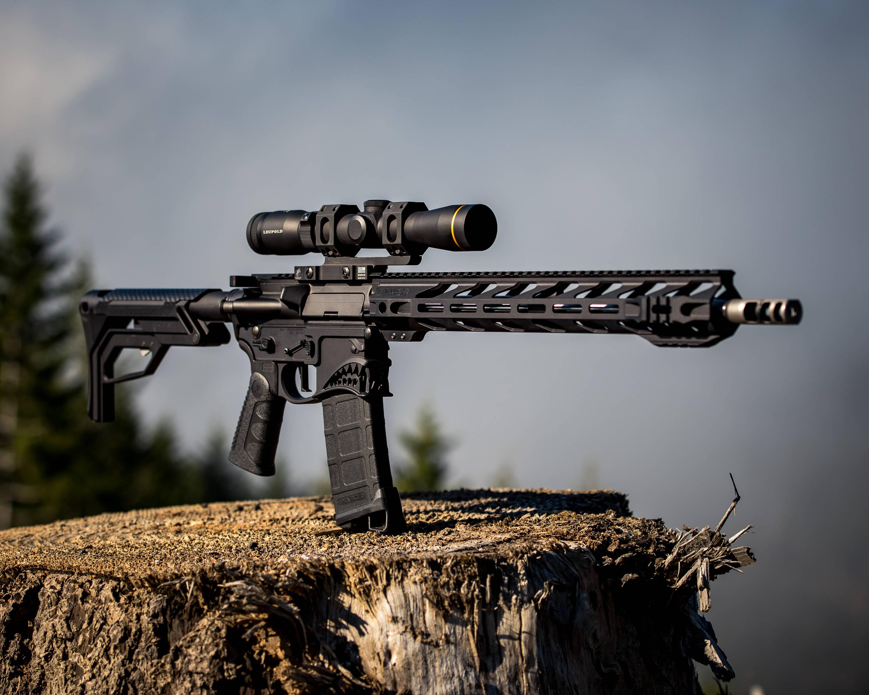 a rifle sits on top of a stump with a scope — 3000x2400 wallpaper