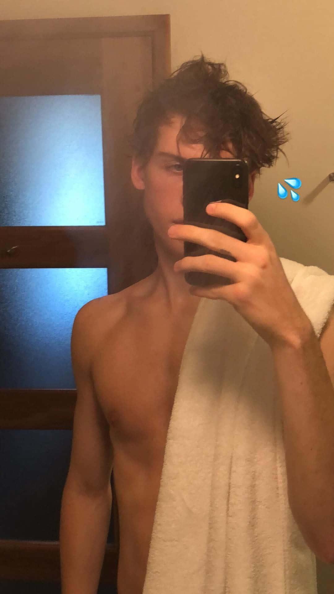 a shirtless man taking a selfie in a bathroom — 1080x1920 wallpaper