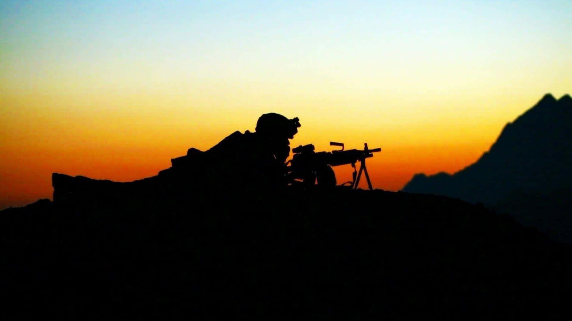 a silhouette of a soldier on top of a mountain — 1920x1080 wallpaper