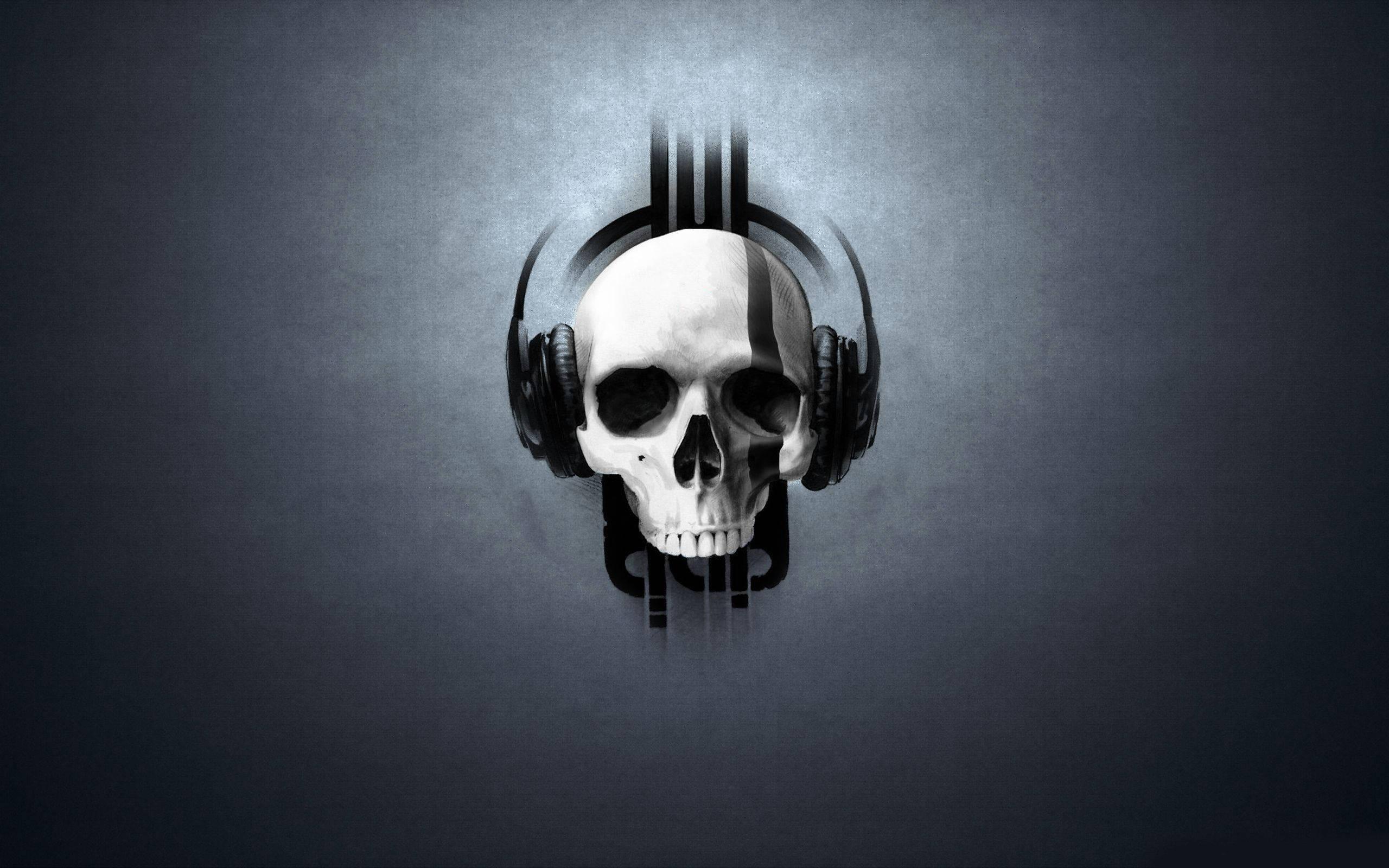 A skull with headphones and a guitar — 2560x1600 wallpaper