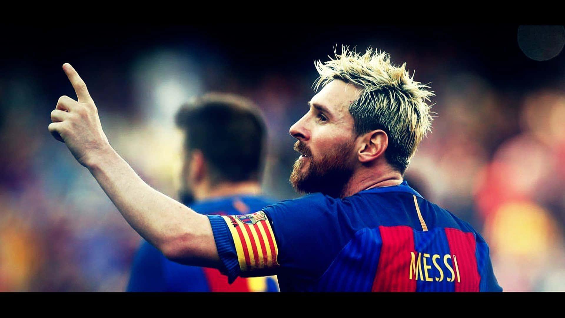 a soccer player is pointing to the goal — 1920x1080 wallpaper