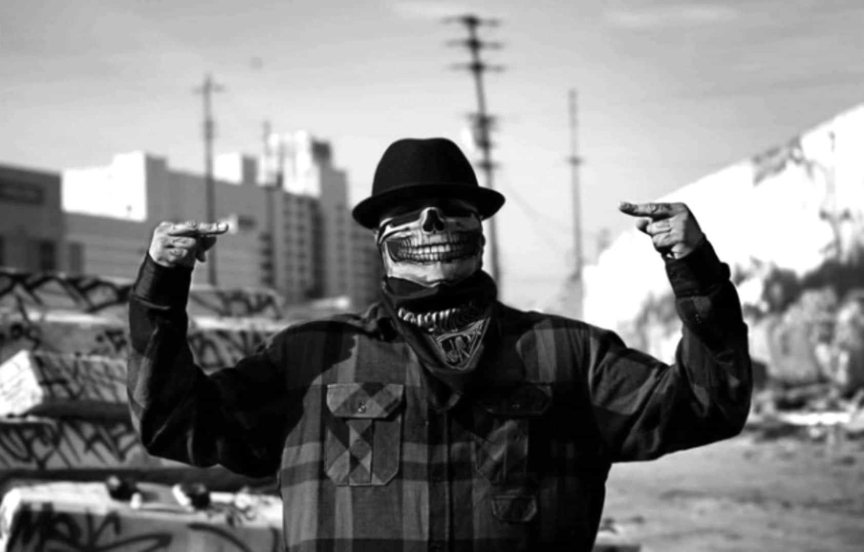 A street hustler poses against a dark alley backdrop in the heart of the city. — 1684x1076 wallpaper
