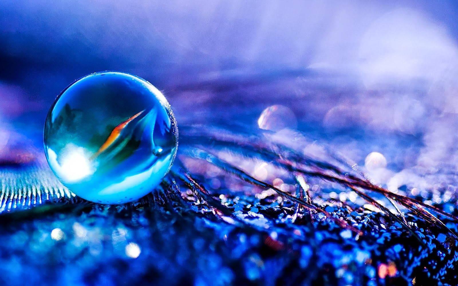 A vibrant blue marble up close. — 1600x1000 wallpaper