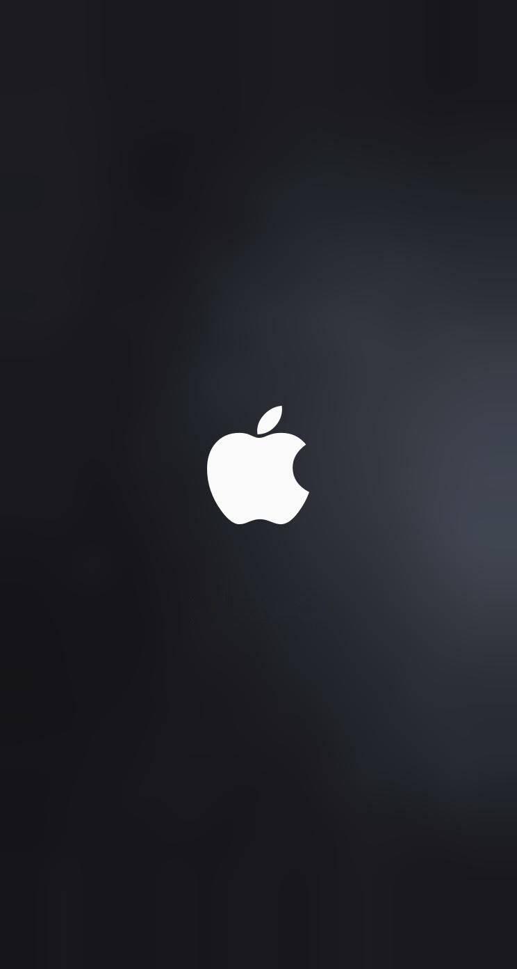 A vivid white Apple logo on a dark gray background — 744x1392 wallpaper