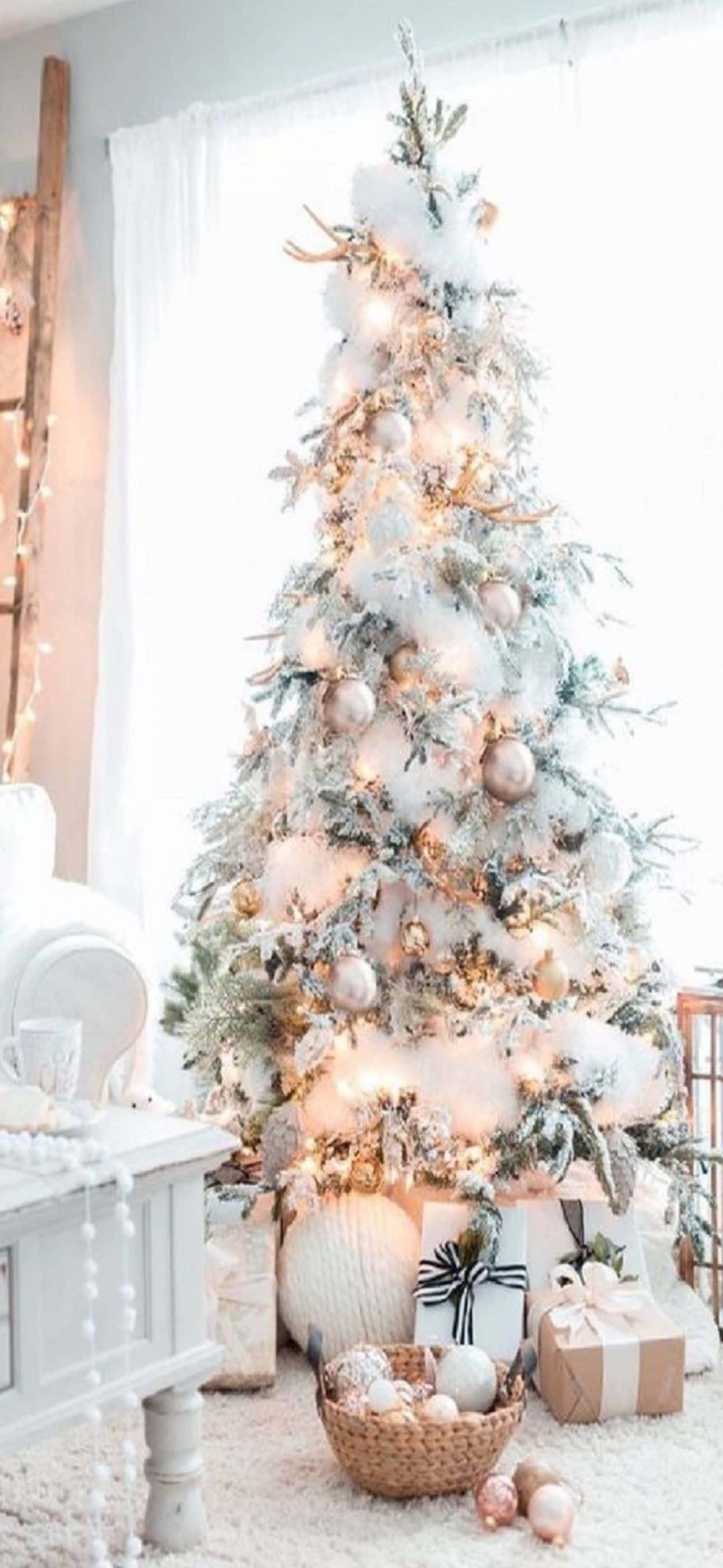 a white christmas tree with white decorations in a living room — 1290x2796 wallpaper