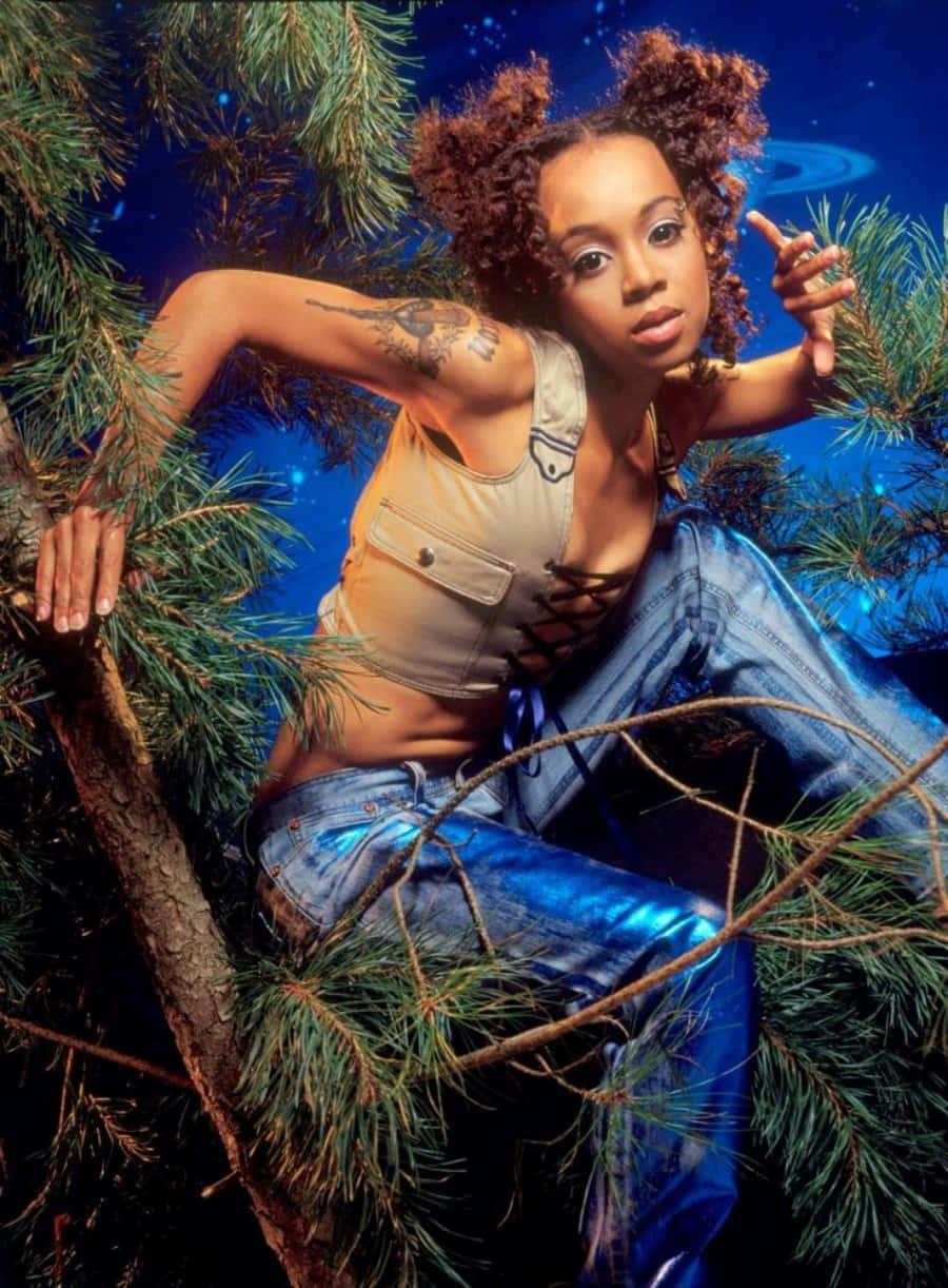 a woman in blue jeans sitting in a tree — 900x1222 wallpaper