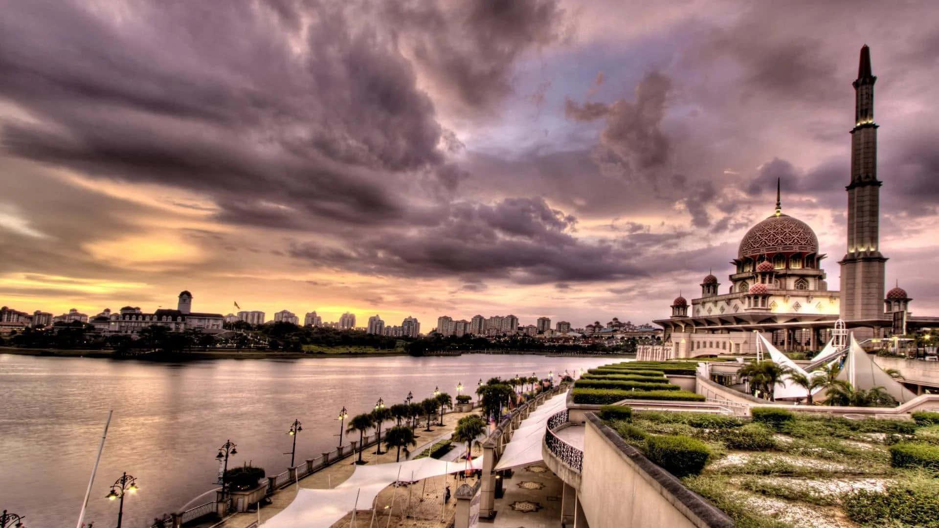 A woman standing in prayer against a backdrop of an Islamic city — 1920x1080 wallpaper