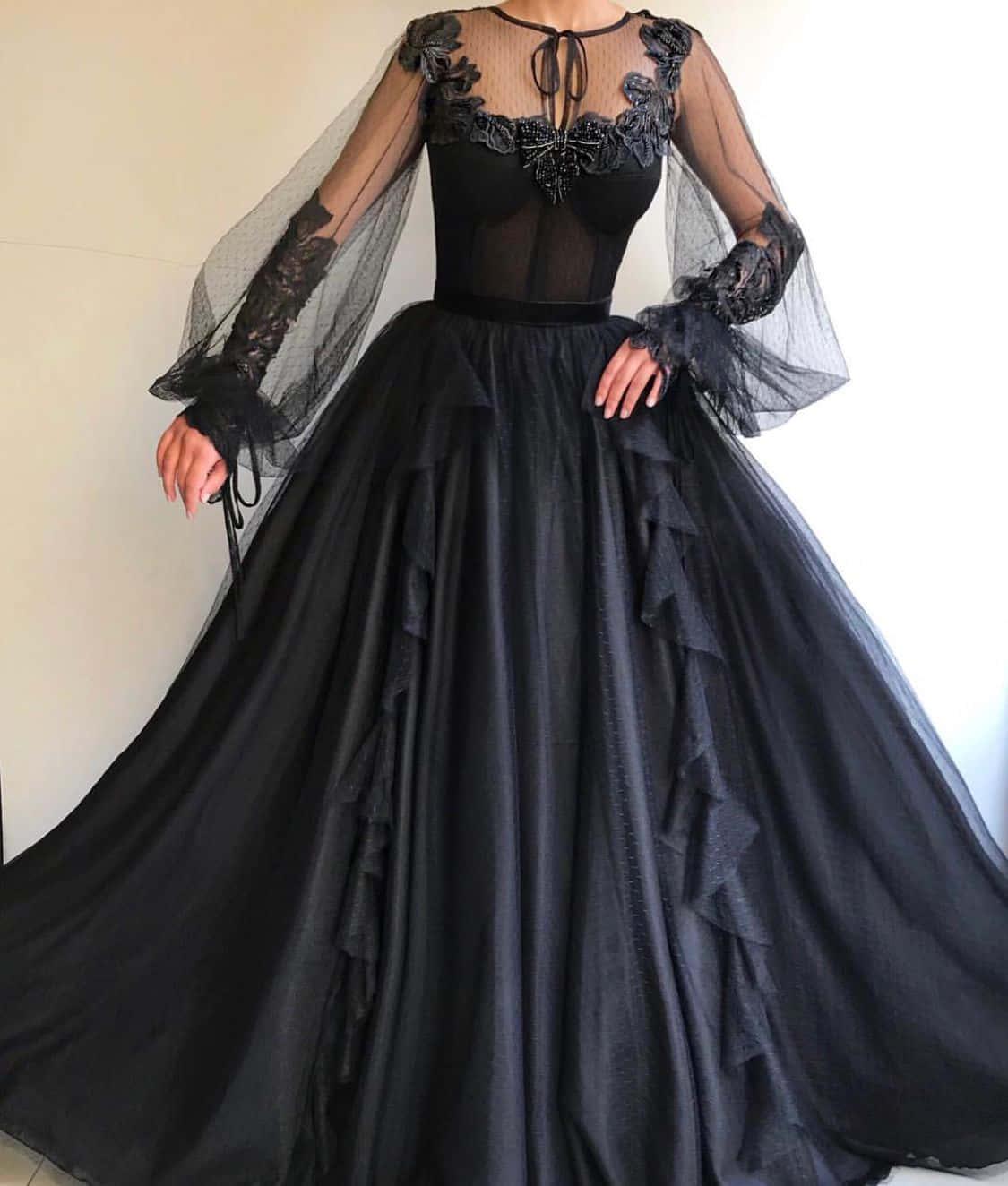 a woman wearing a black dress with lace sleeves — 1125x1324 wallpaper