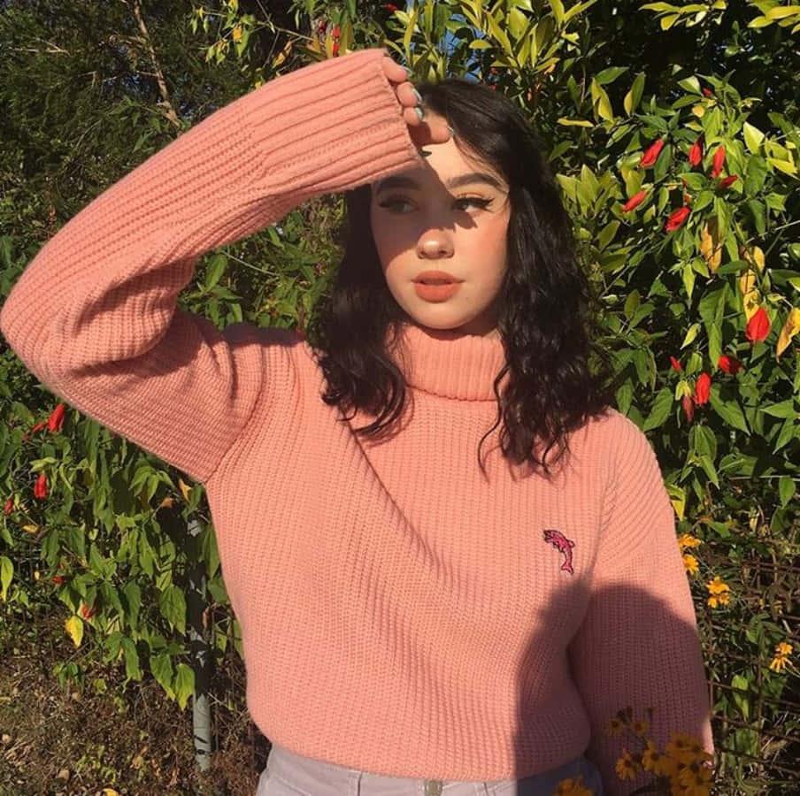 a woman wearing a pink turtleneck sweater — 904x900 wallpaper