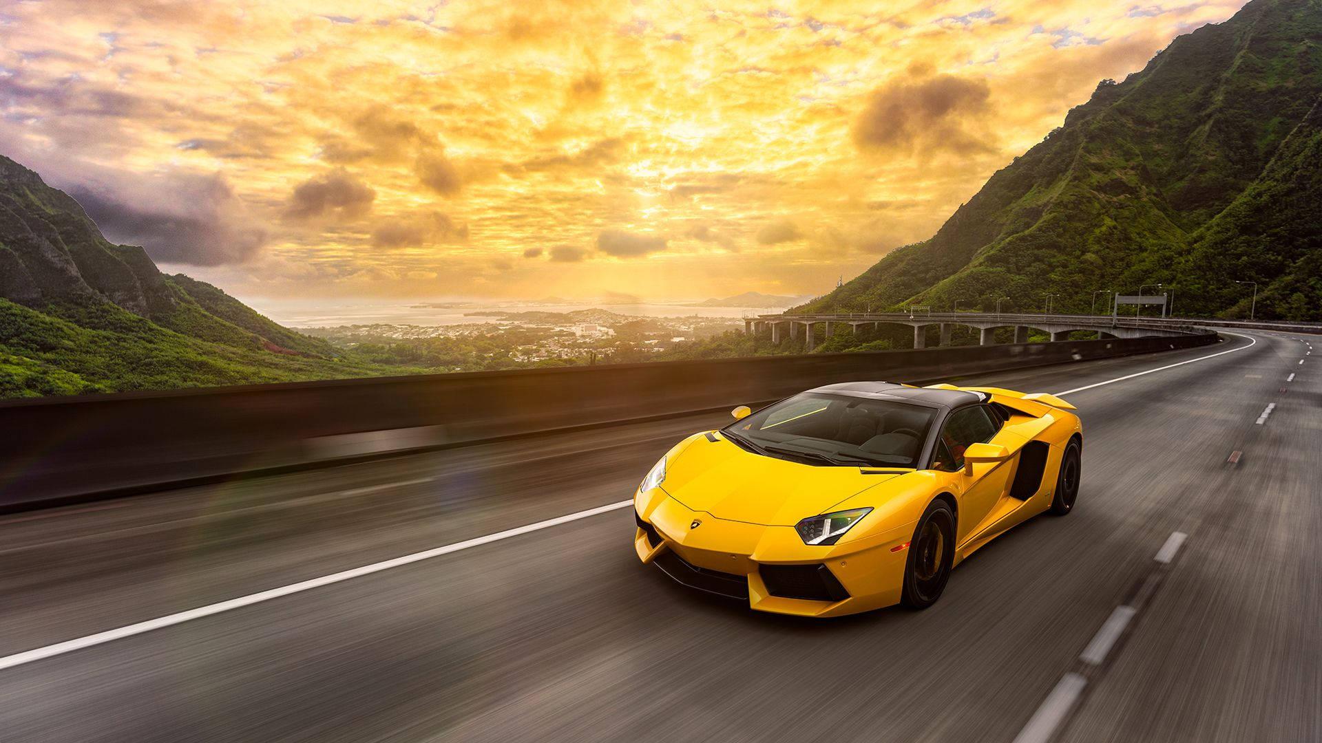 A yellow Lamborghini Aventador in motion. — 1920x1080 wallpaper