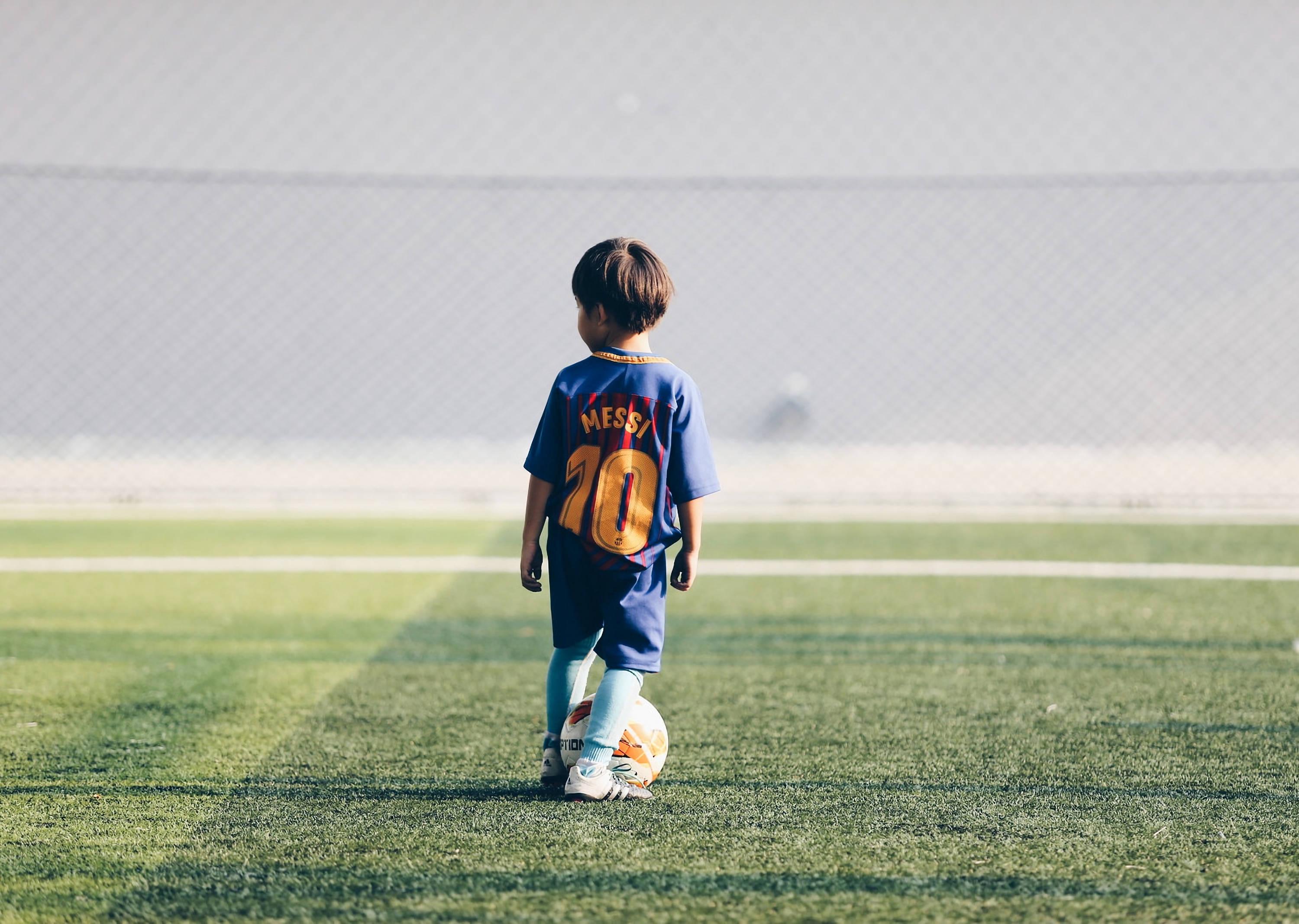 A young hopeful looks forward to one day wearing Lionel Messi's jersey. — 3000x2134 wallpaper