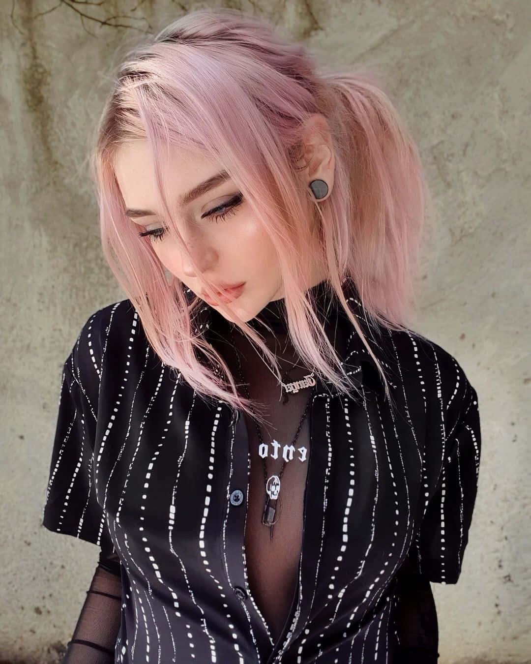 A young woman with a unique sense of style exudes confidence and an aura of effortless beauty — 1080x1350 wallpaper