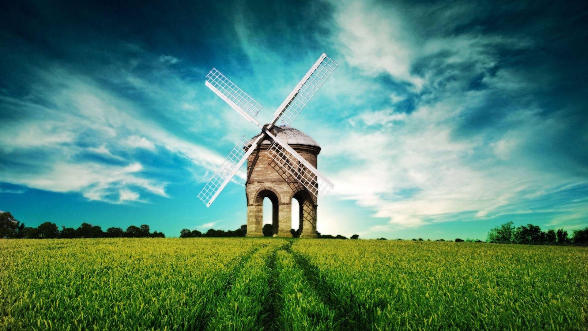 An aerial view of a windmill against a grass-filled landscape — 1920x1080 wallpaper
