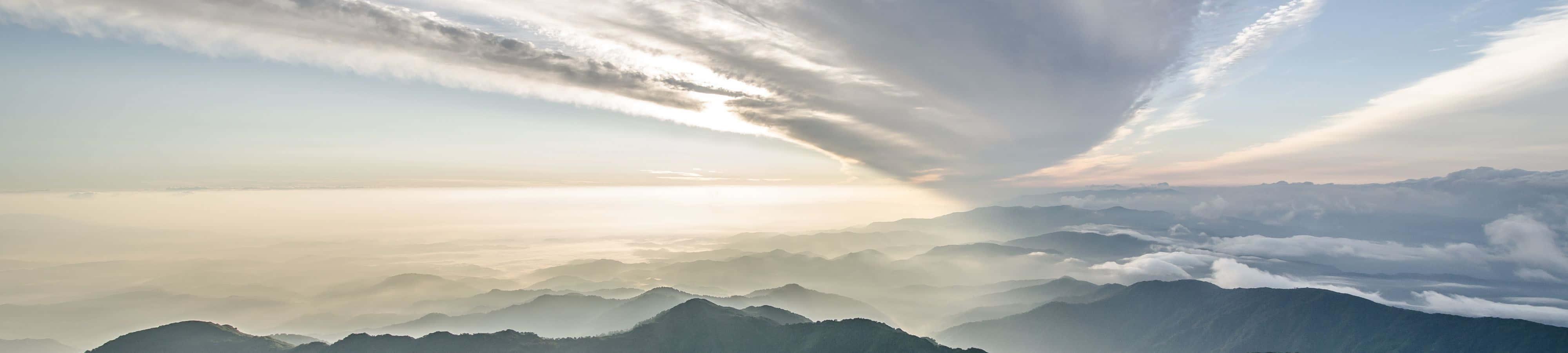 An aerial view of the vibrant Green Valley below — 4000x900 wallpaper