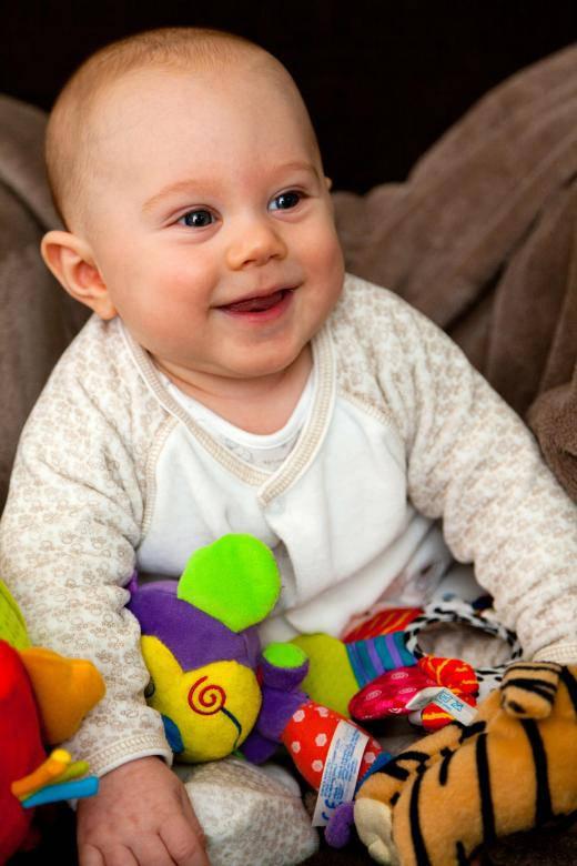 Baby Boy Smiling With Toys — 520x780 wallpaper
