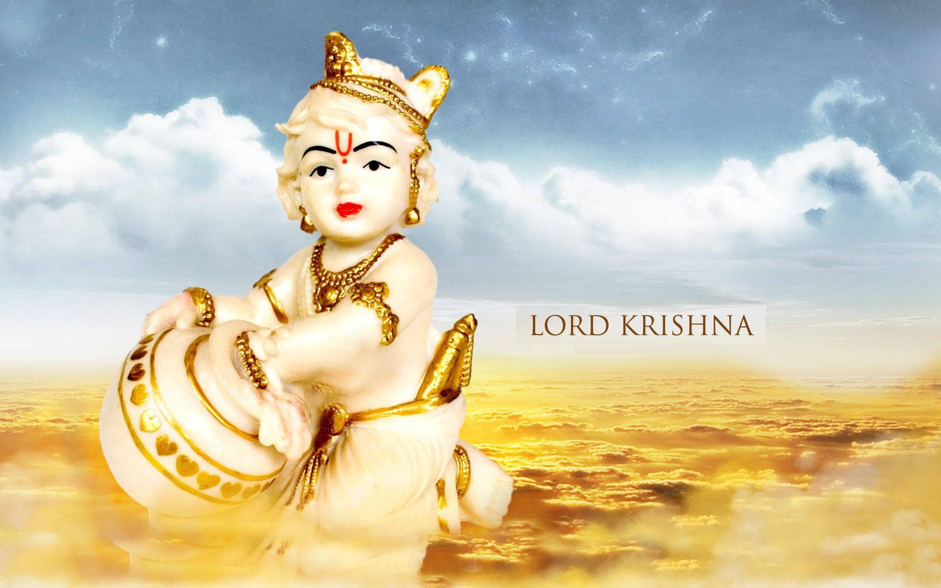 Bal Krishna Figurine Over Gold Clouds — 1920x1200 wallpaper