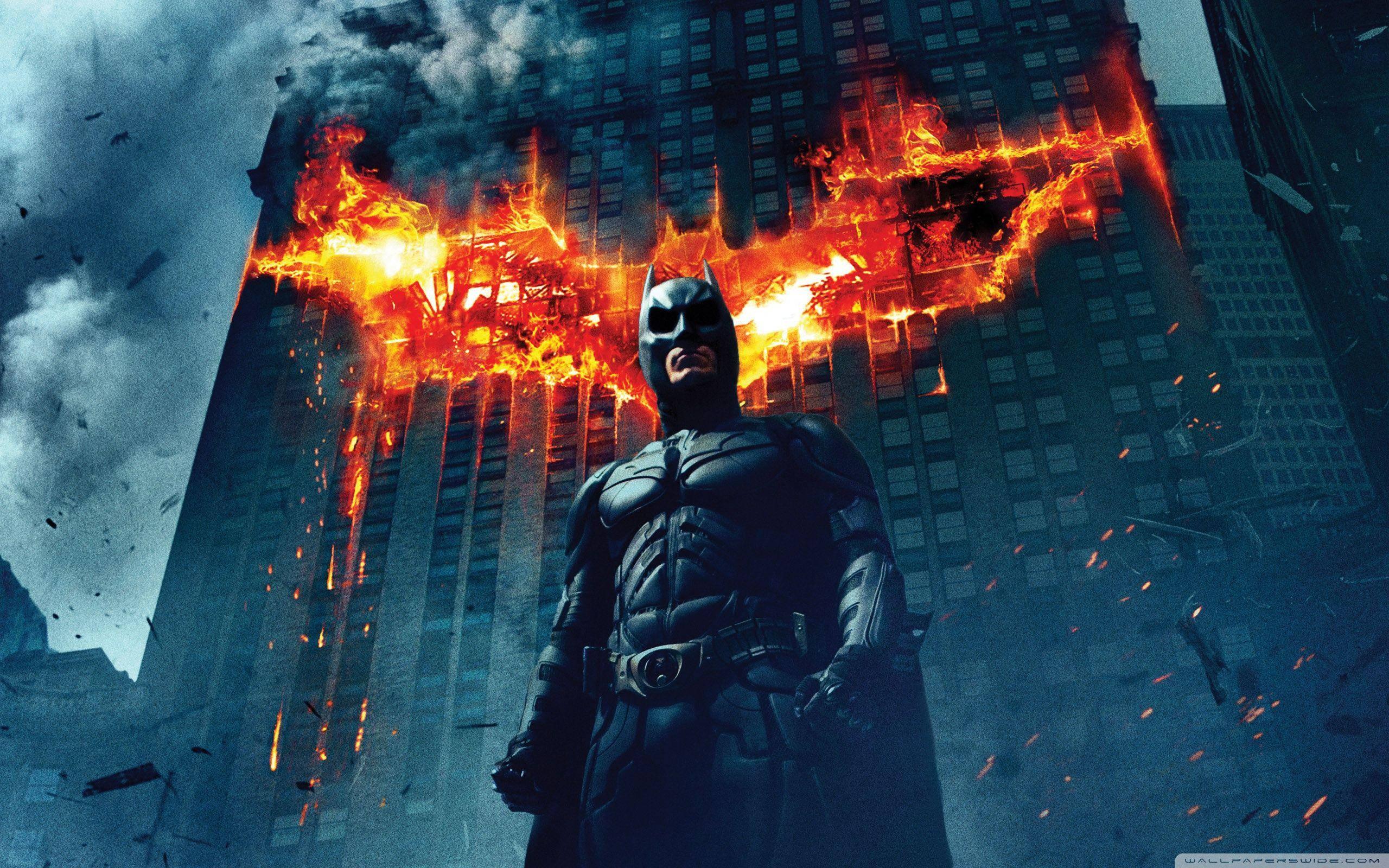 Batman Standing With Burning Building 4K — 2560x1600 wallpaper