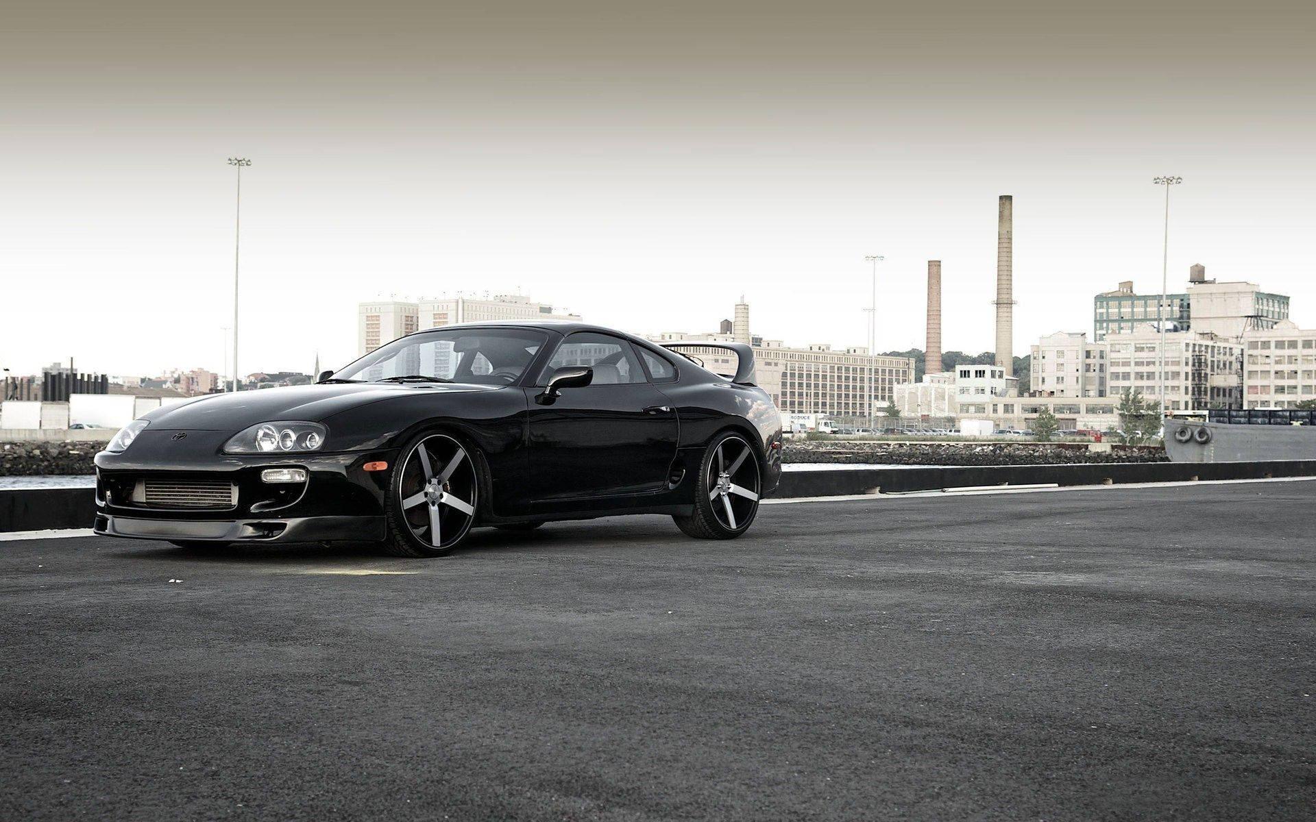 Black Toyota Supra Near City Bay — 1920x1200 wallpaper