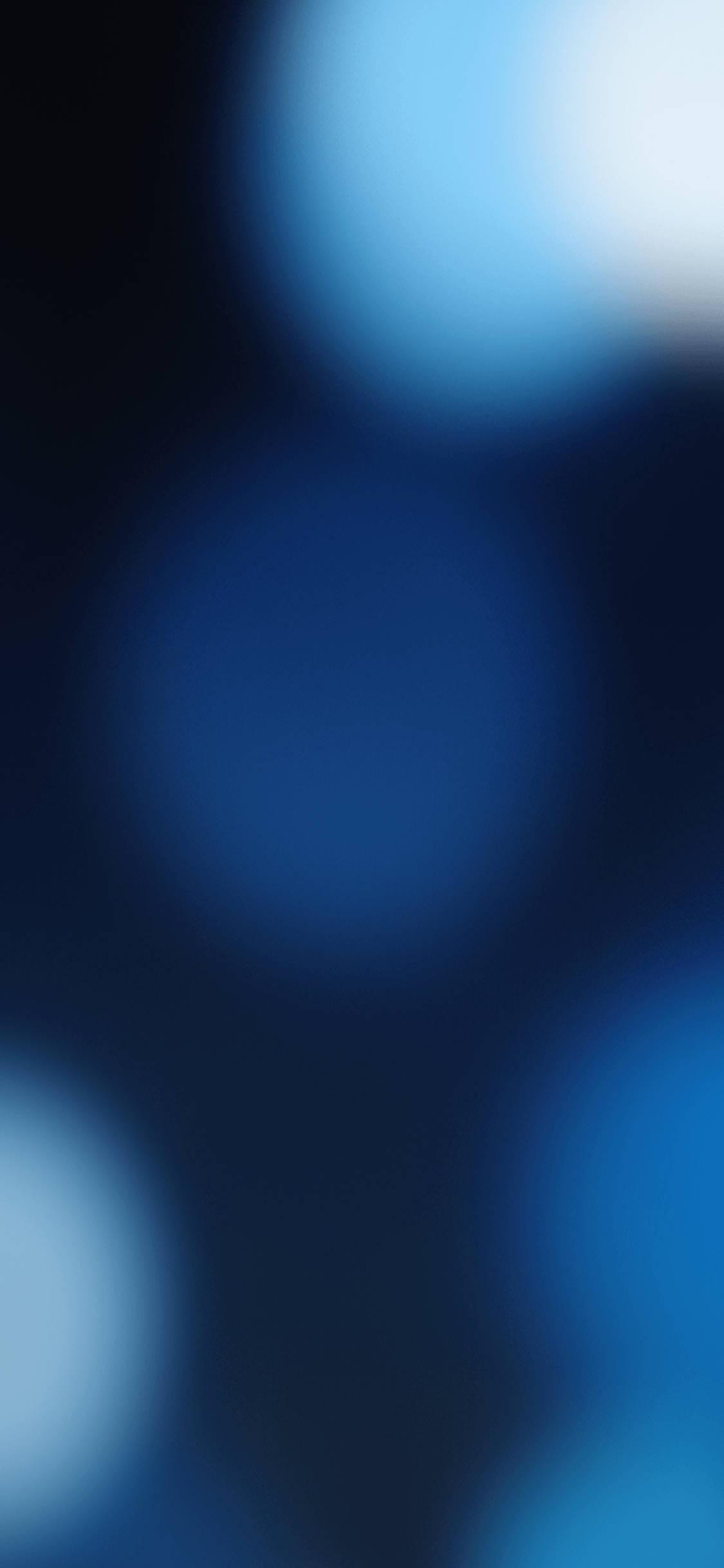 Blue Bokeh Ios 16 — 1125x2436 wallpaper
