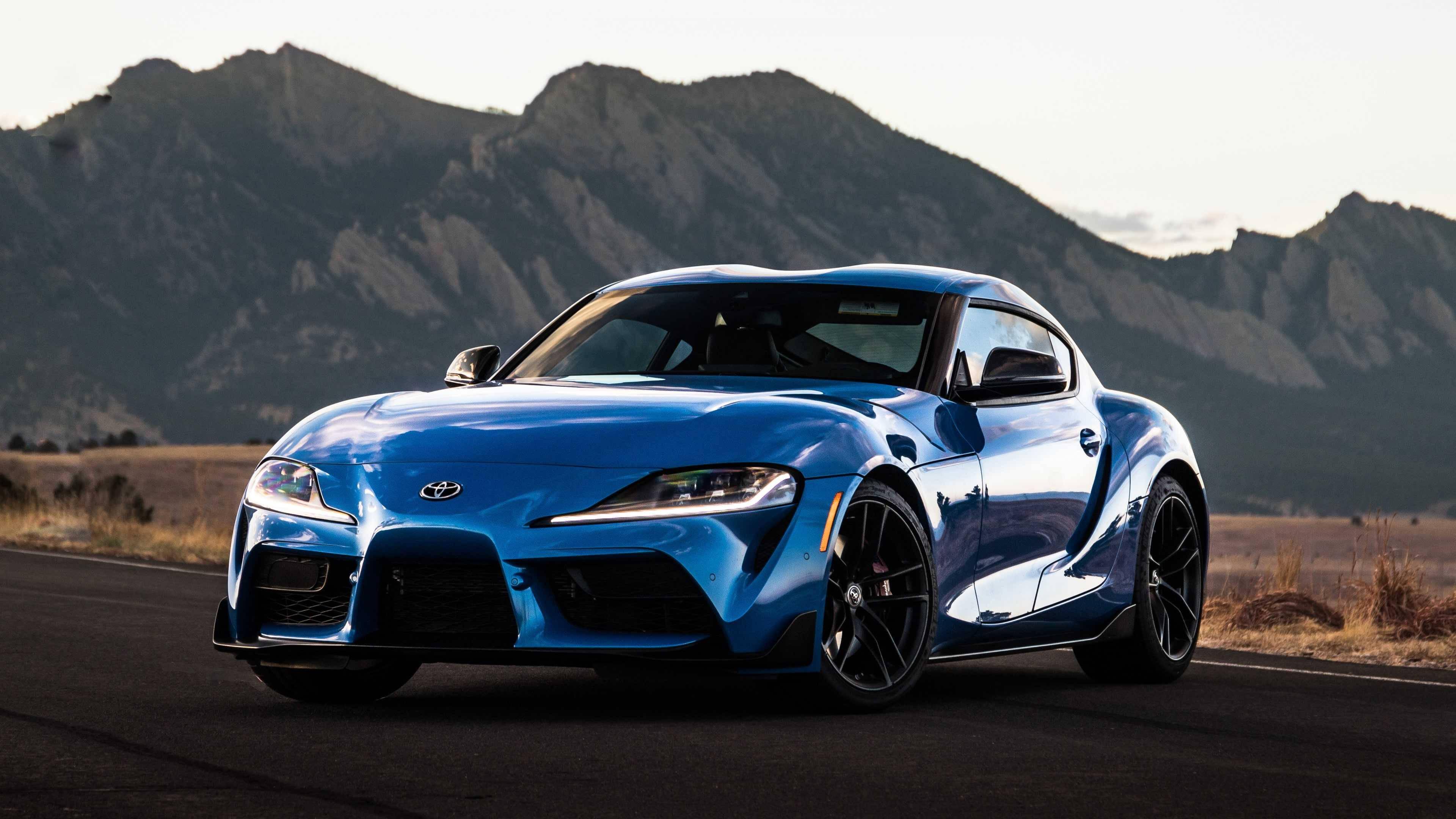 Blue Toyota Supra Near Terrains — 3840x2160 wallpaper