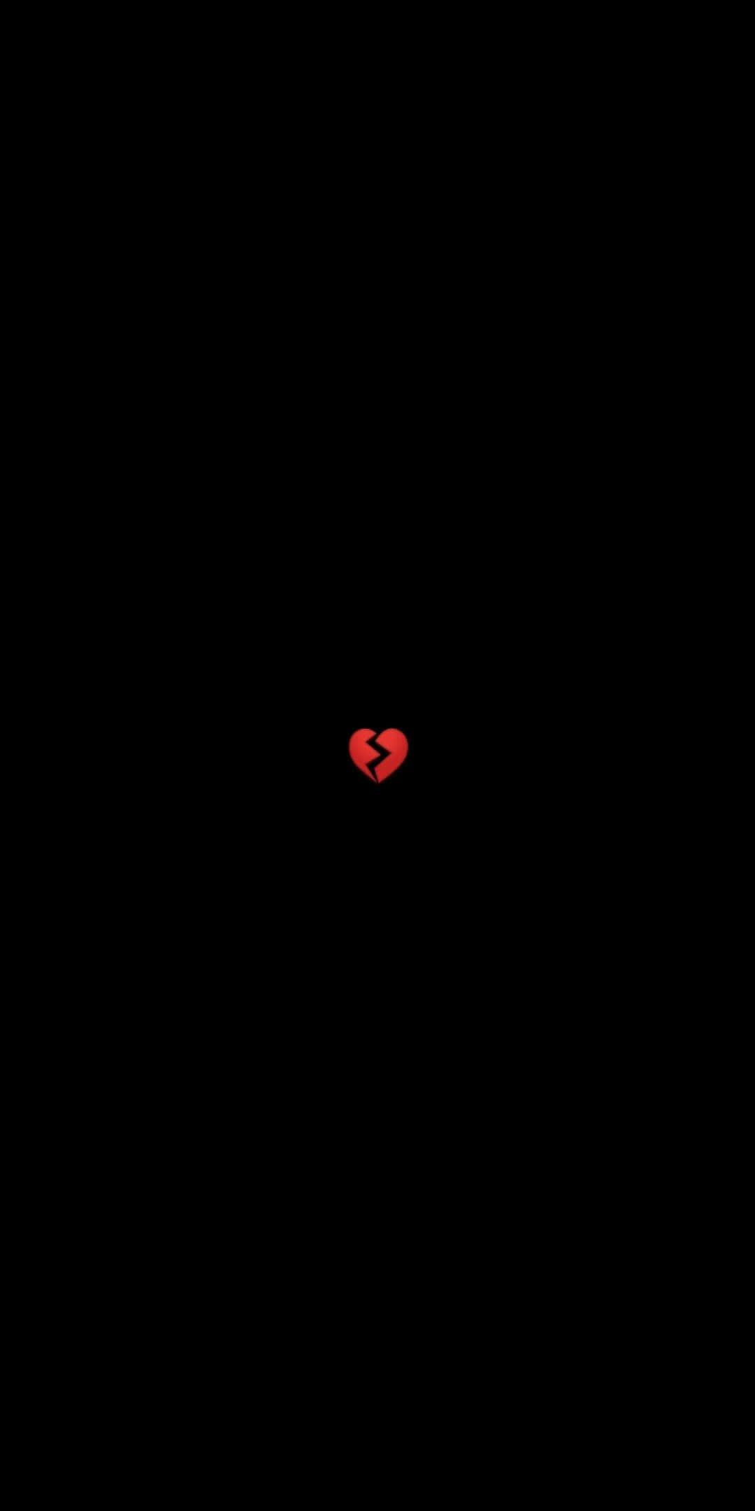 Broken heart on a dark background — 1080x2160 wallpaper