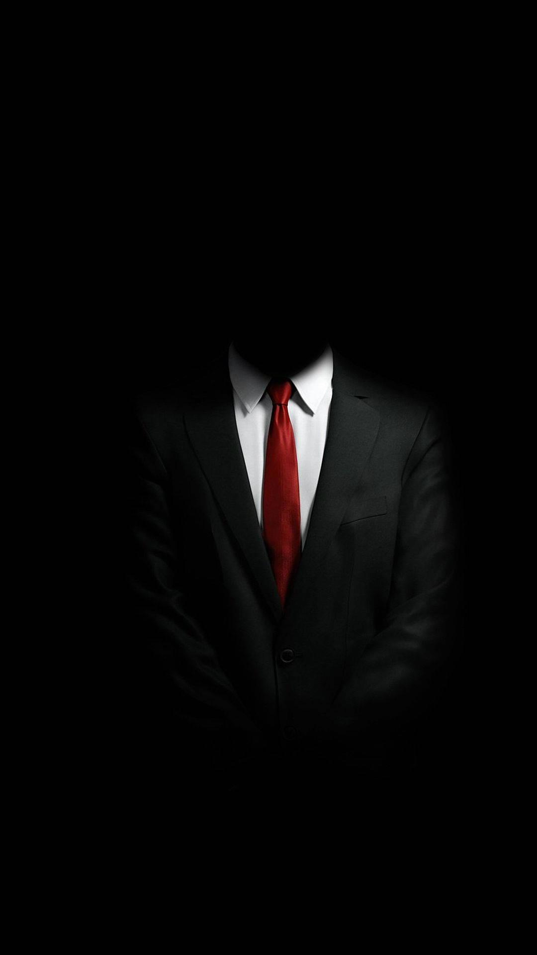 Businessman Using Mobile Phone in Dark Setting — 1080x1920 wallpaper