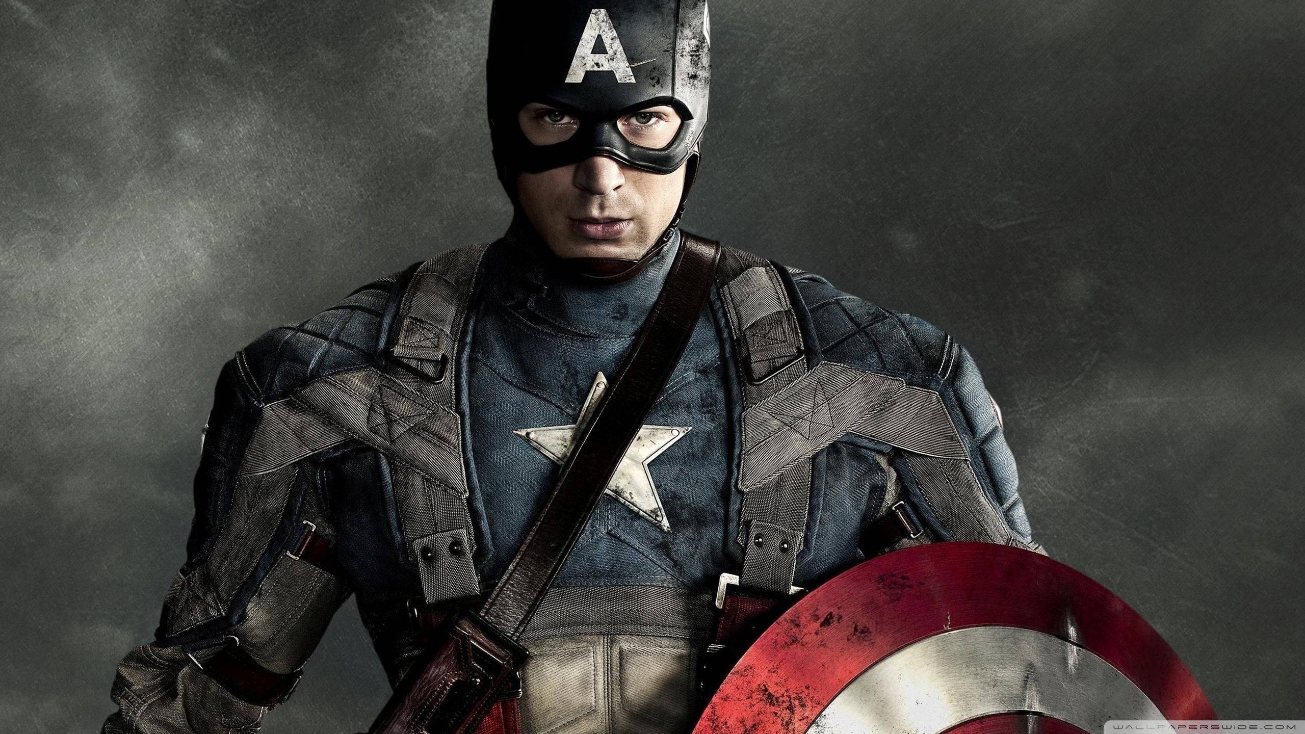 Captain America triumphant on dark clouds — 2560x1440 wallpaper