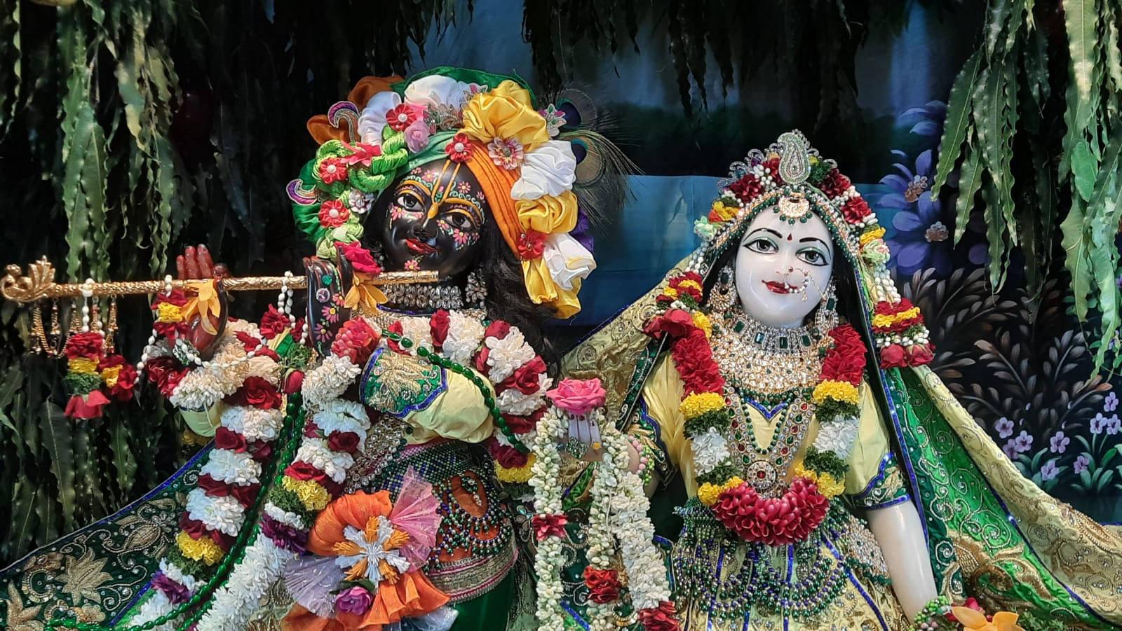 Captivating Divine Scene of Radha and Krishna at ISKCON — 1600x901 wallpaper