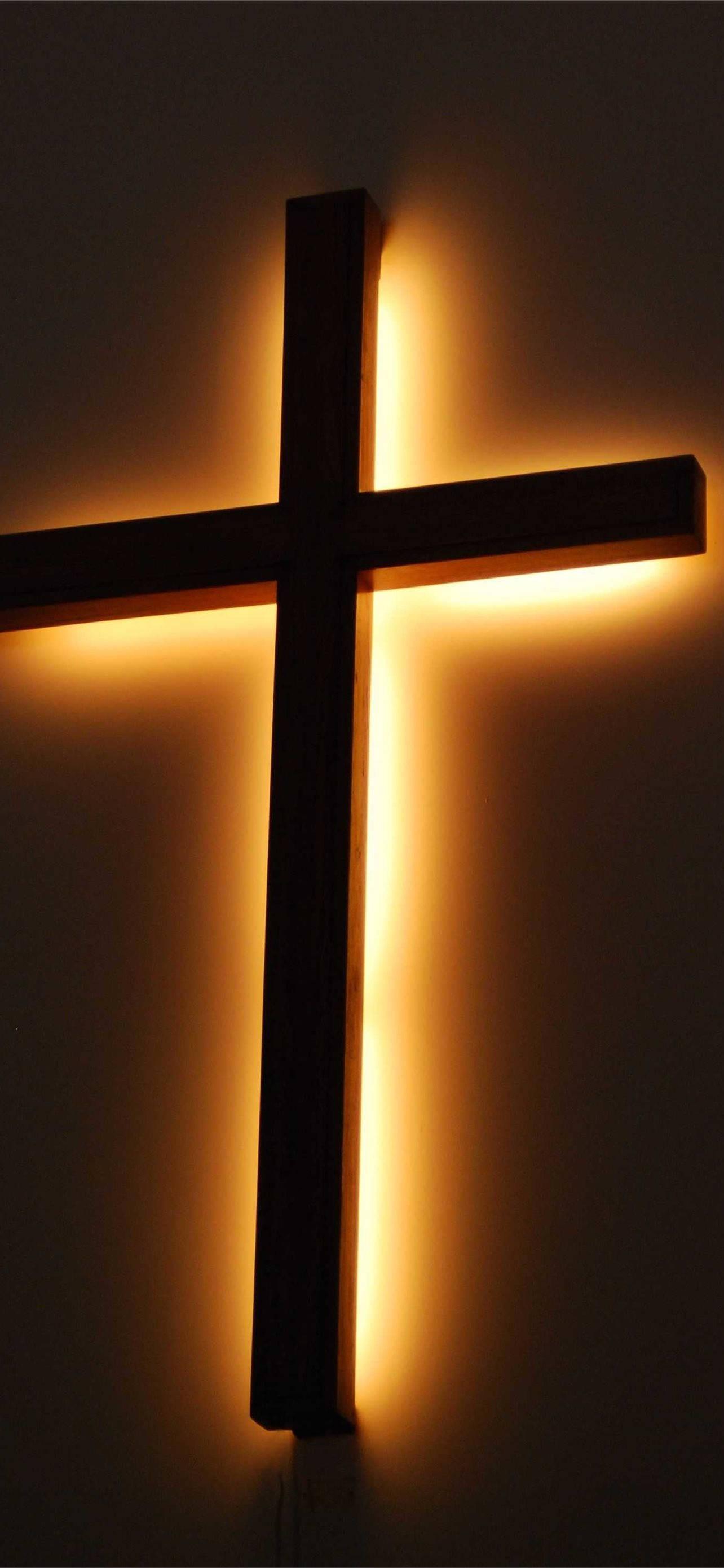 Christian Cross In Warm Light — 1284x2778 wallpaper