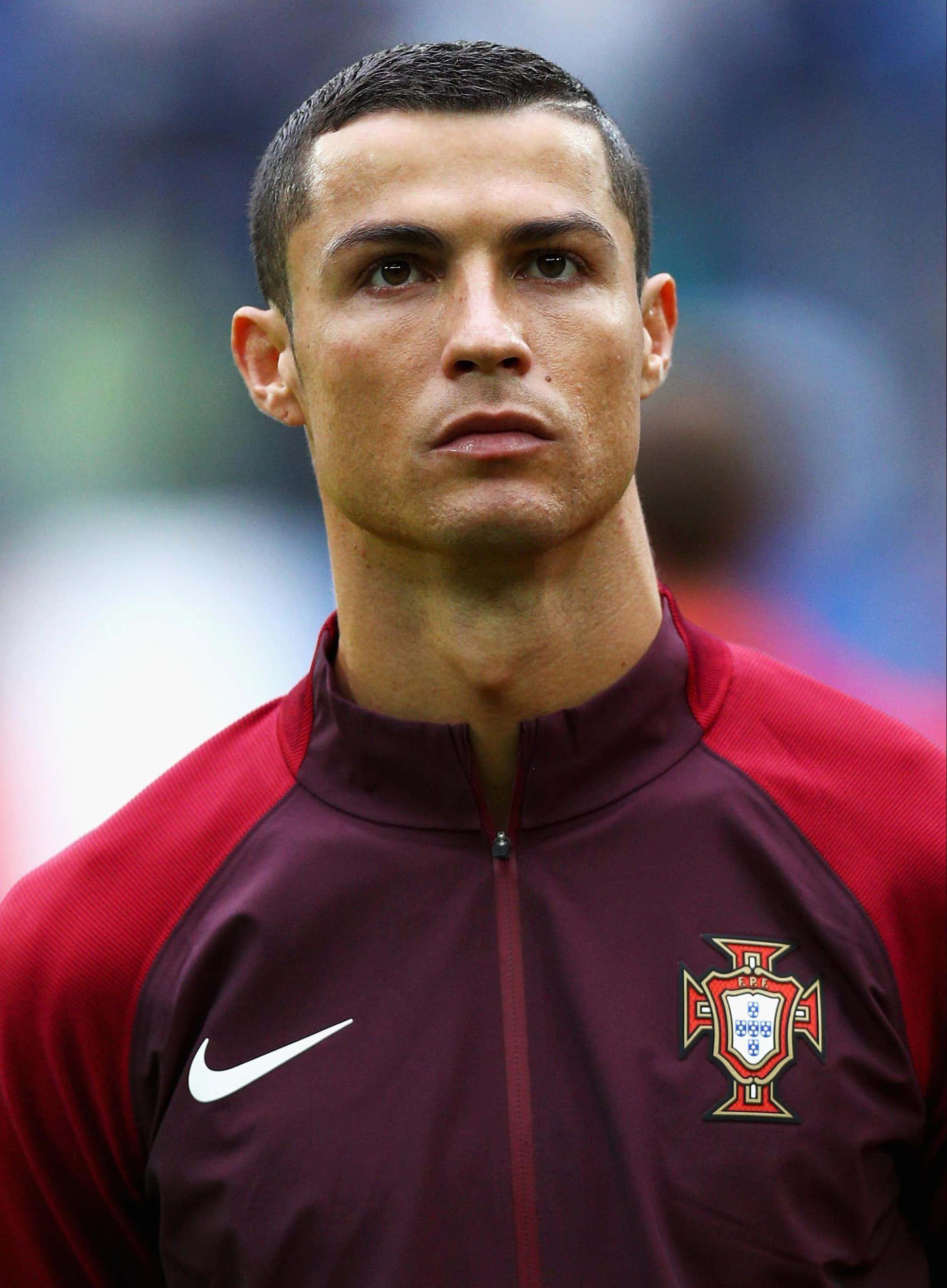 Cristiano Ronaldo Leaping in Action on the Field
