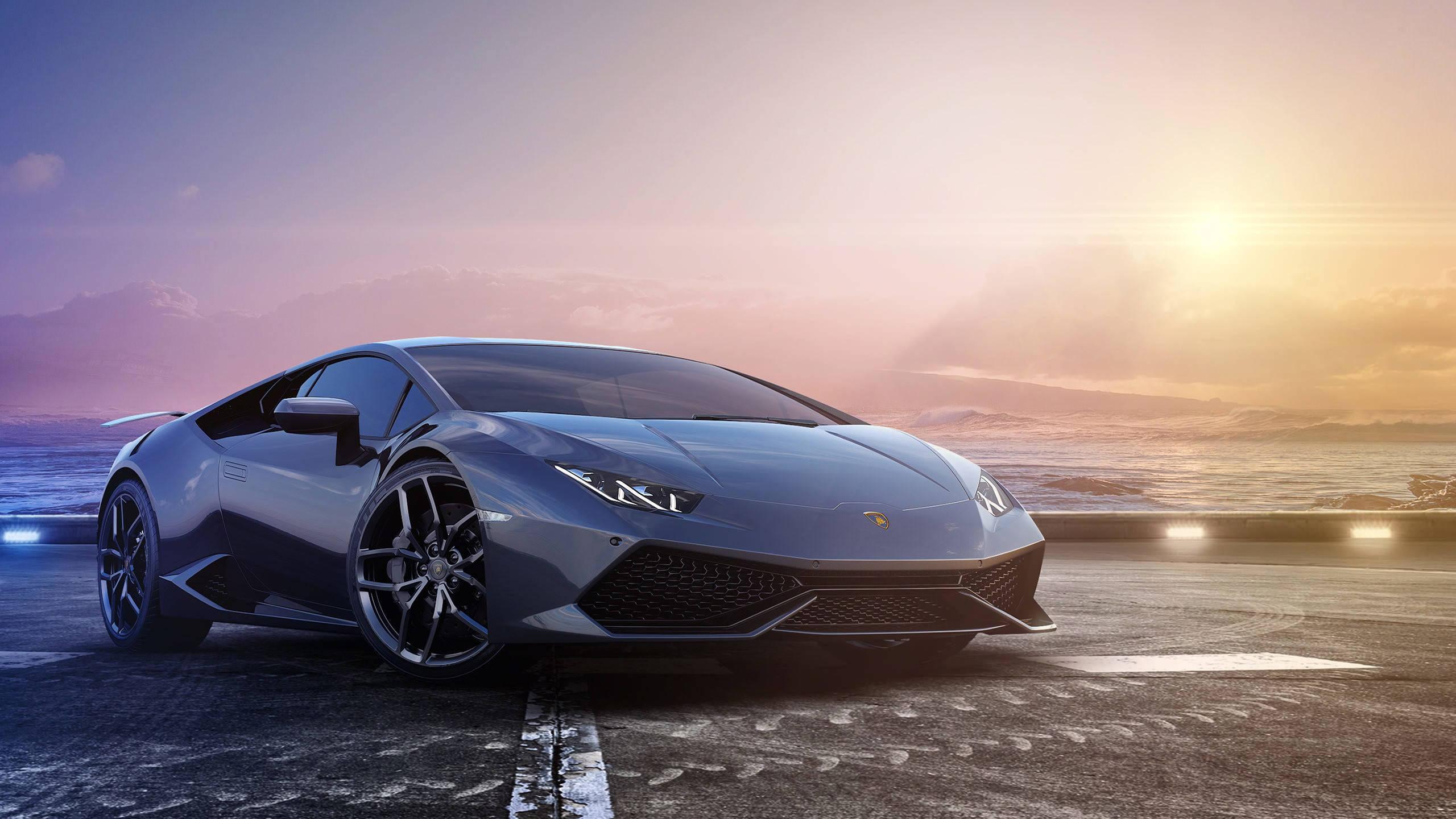 Cruising Along the Coast in a Black Lamborghini Huracan — 2560x1440 wallpaper