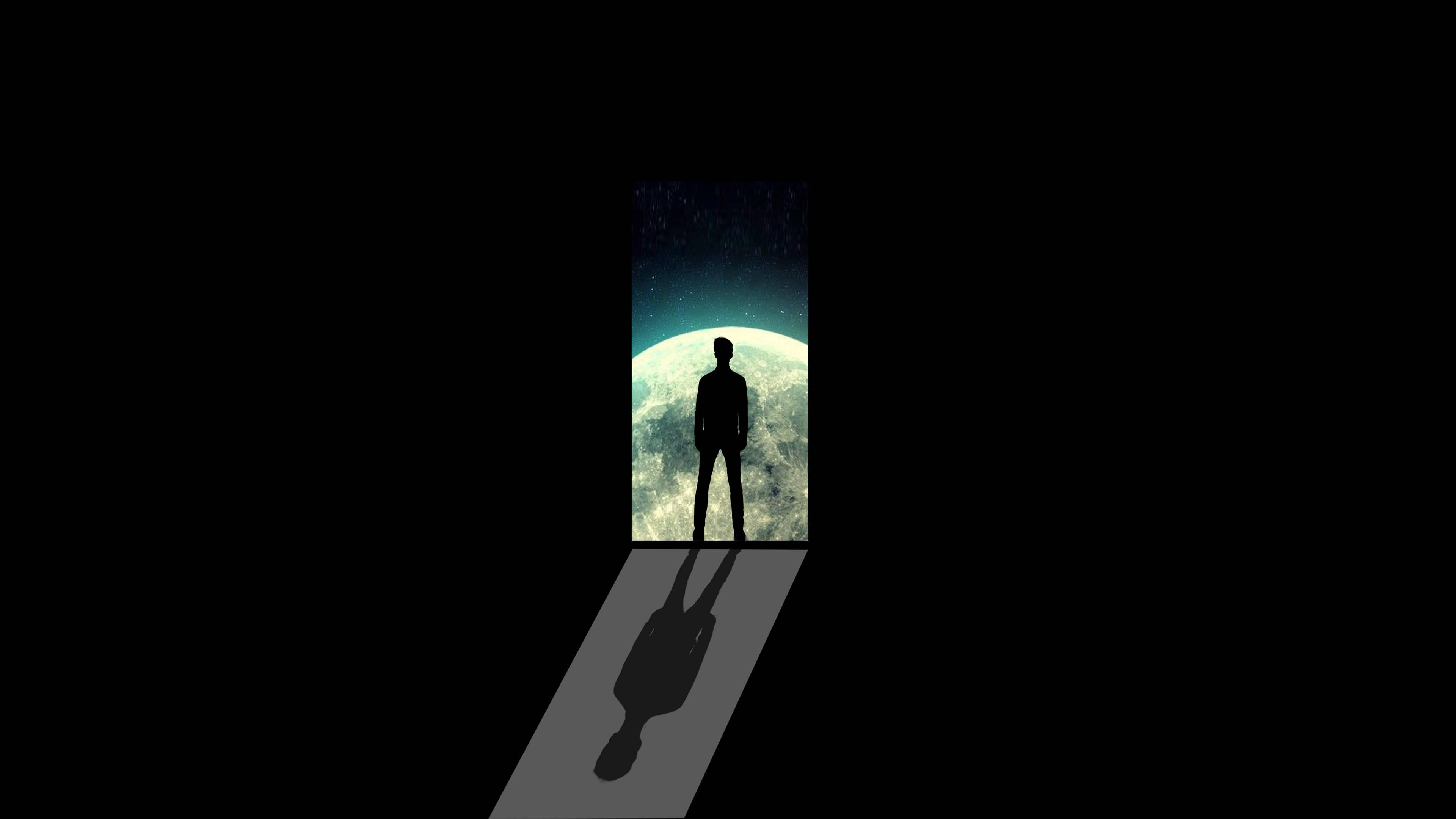 Dark Laptop Man Standing Facing The Planet — 3840x2160 wallpaper