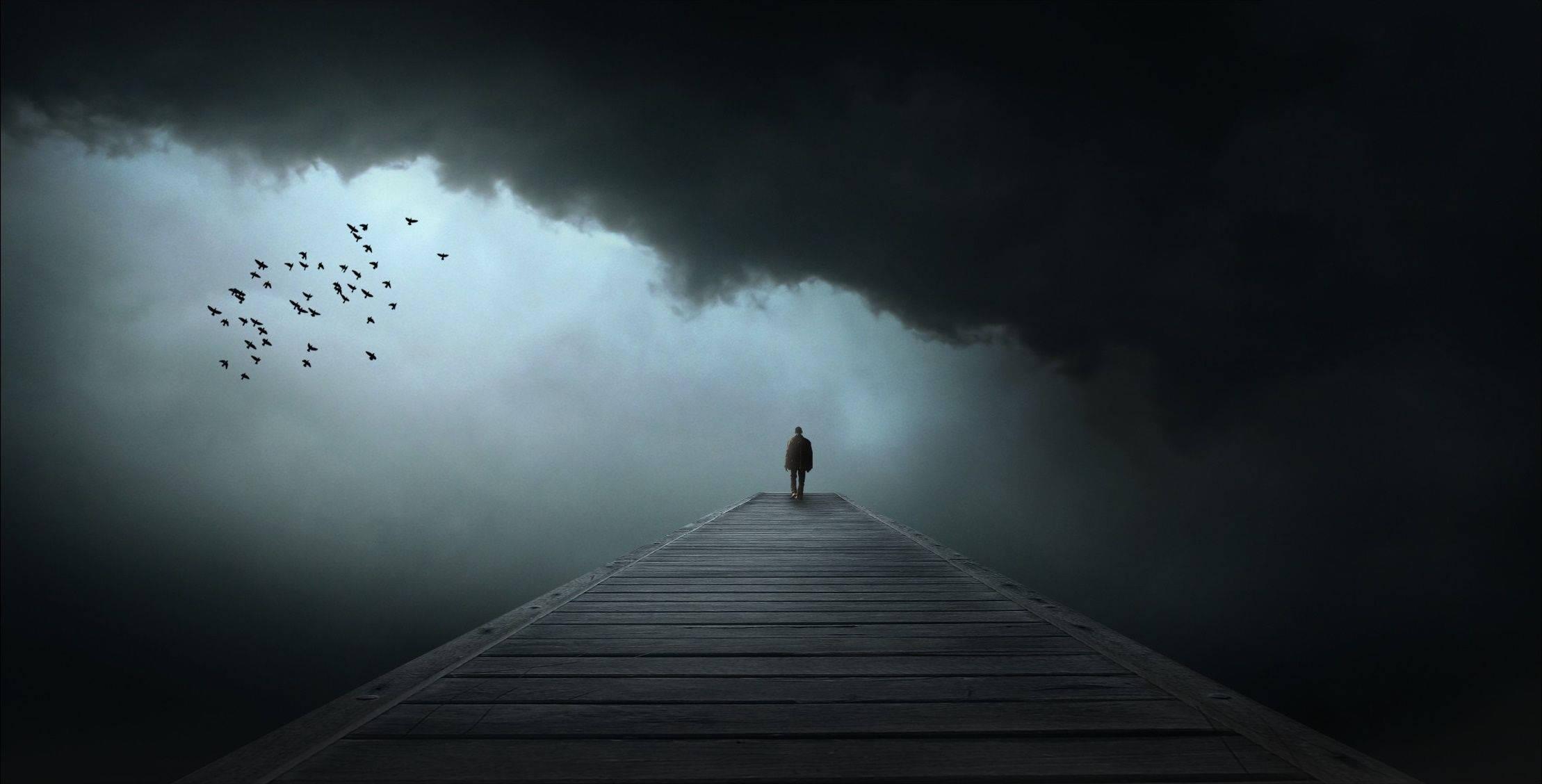 Dark Silhouette of Solitary Man — 2218x1128 wallpaper
