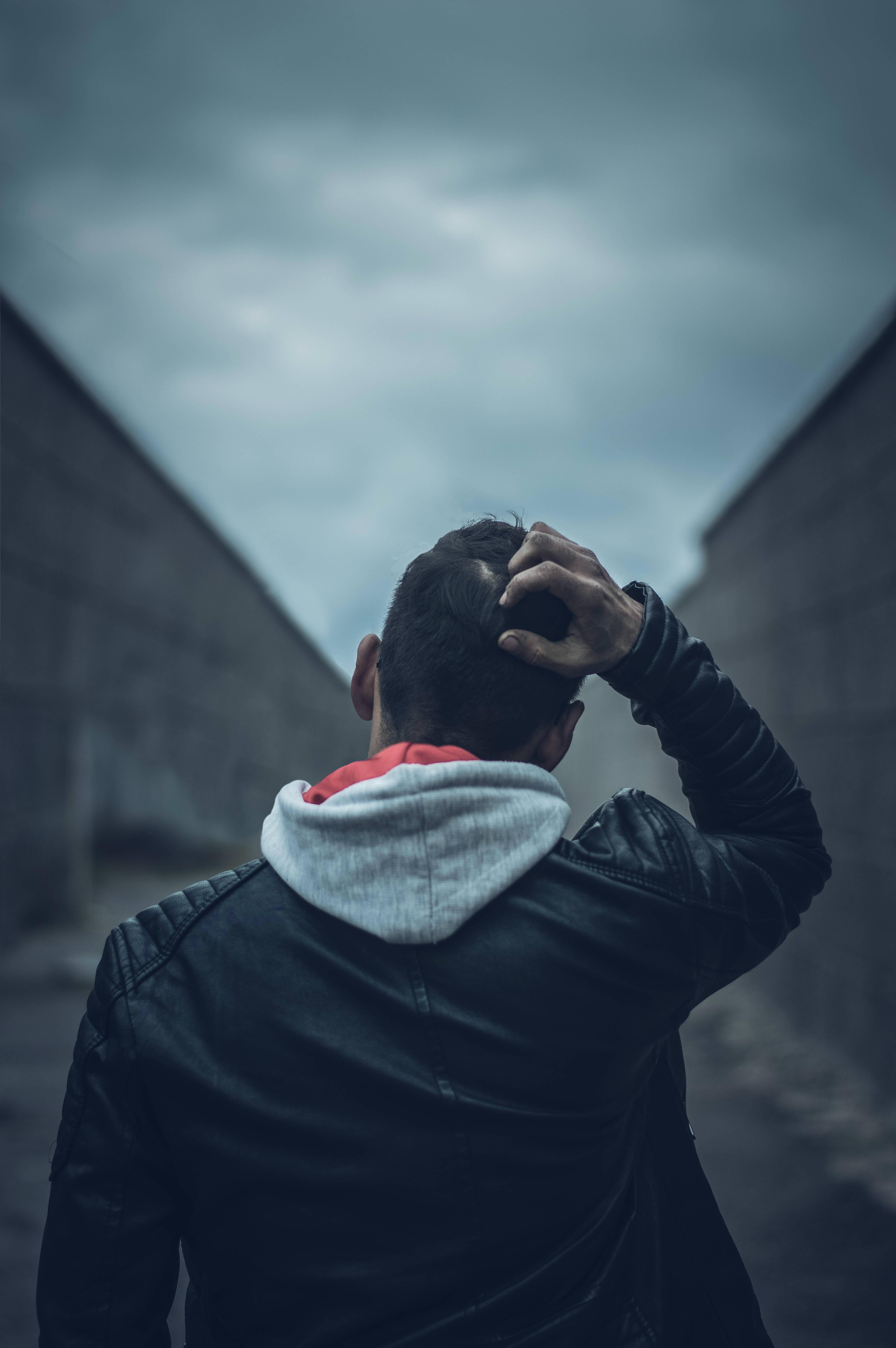 Desolate Emotions - A Solemn Young Boy Against a Vast Perspective — 4000x6016 wallpaper
