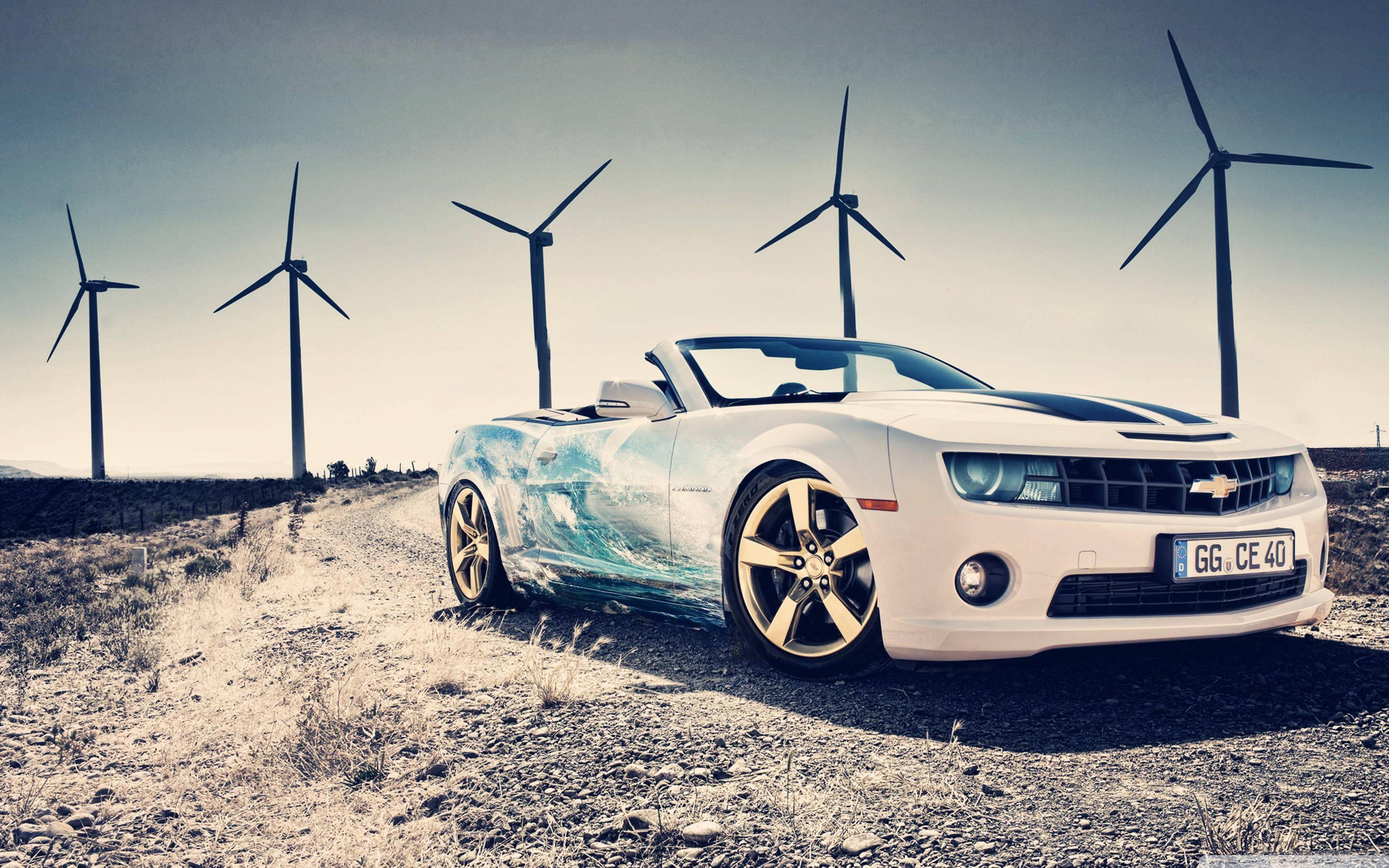 Driving through Windmills in a Luxury Car — 2880x1800 wallpaper